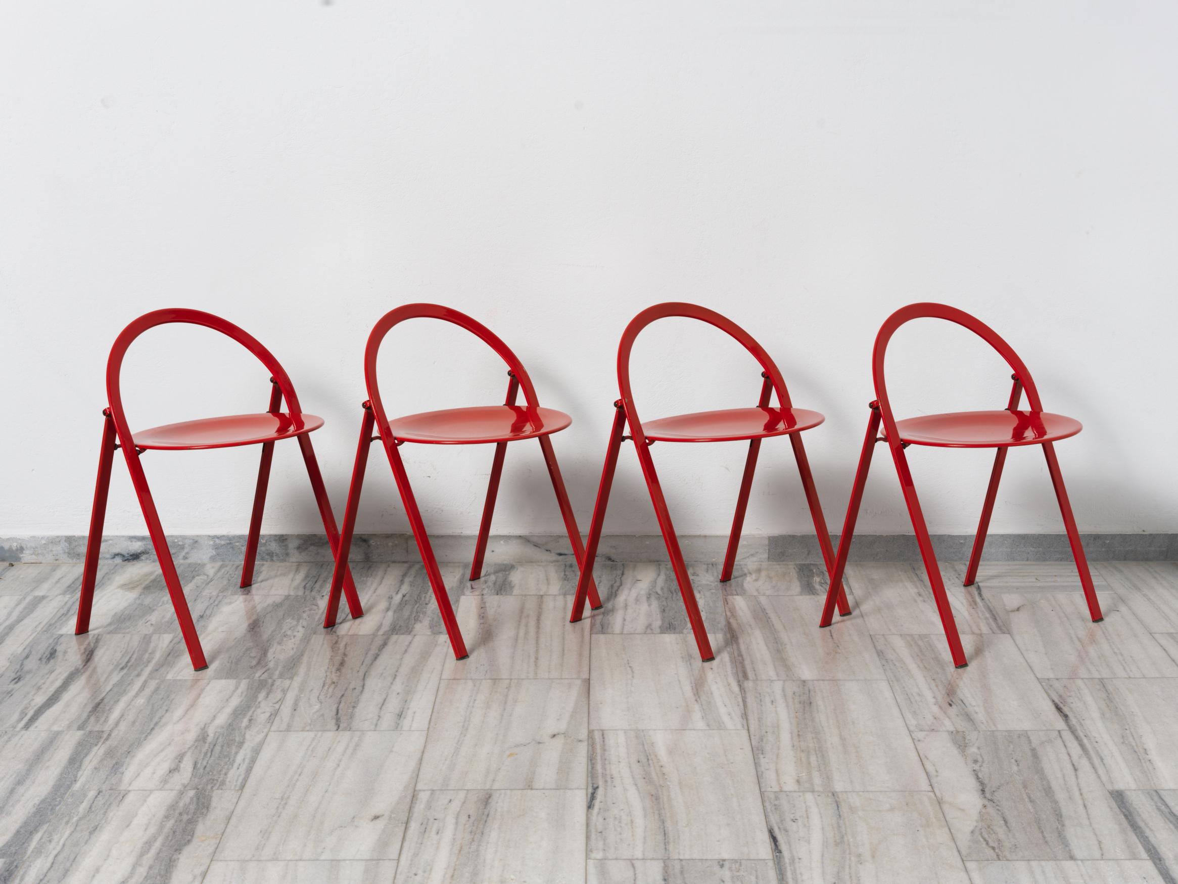 A beautiful set of 4 red glossy metal folding chairs designed by Giorgio Cattelan for Cidue, Italy 1970s.
The design is striking! Minimal, elegant and chic!