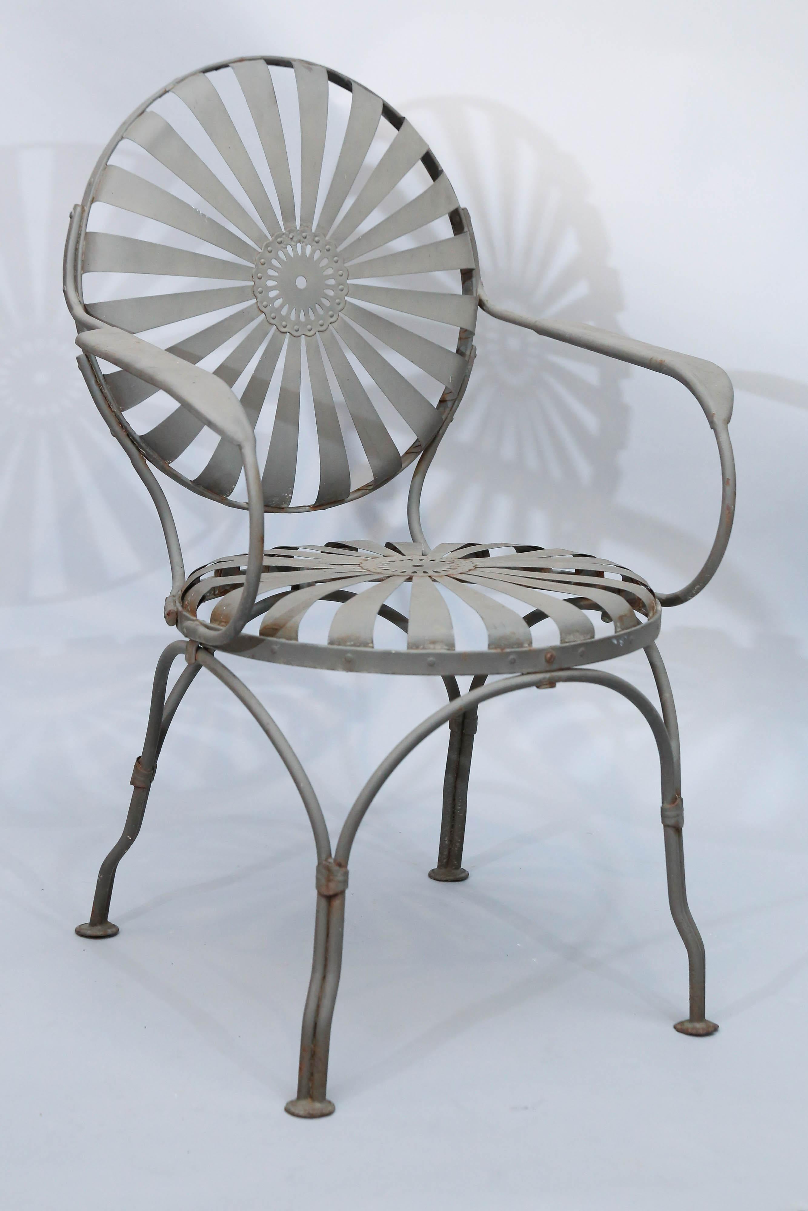 Set of 4 Francois Carre Art Deco sunburst metal dining chairs
are a classic design from 1930.

 