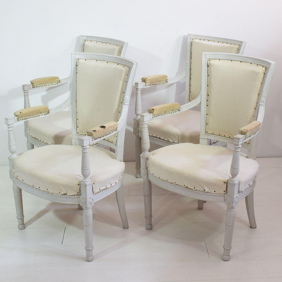 Beautiful and rare set of 4 French original Directoire chairs, France, 18th century.
 At this moment in their underwear. Seat height is 42 cm.
 Despite of their high age, the chairs are in a relative good condition. 
Several layers of paint