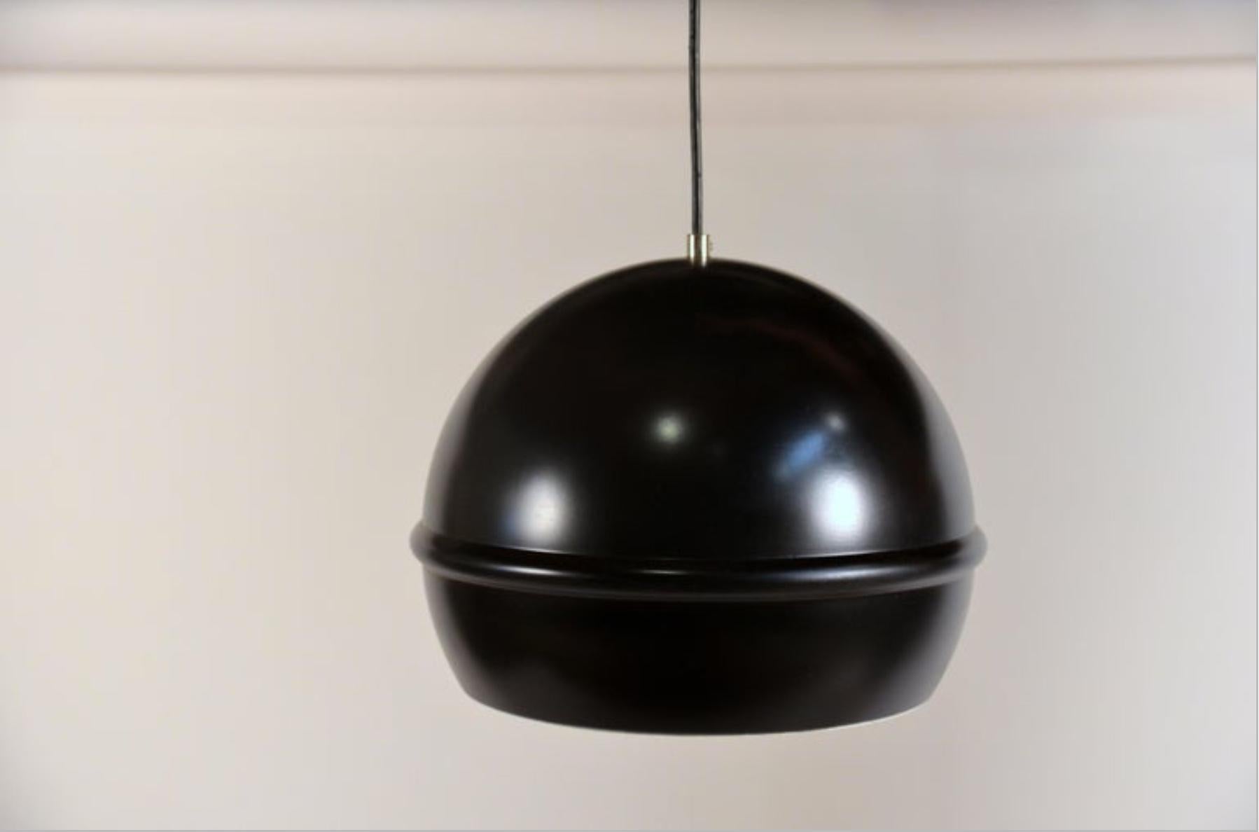 Set of 4 French 1960s black globe pendants. Matching canopies.

Can be installed aligned, in a grid, or in a cluster at different heights.

Perfect with silver- or gold-tipped bulbs.

Priced as a set of 8 but can also be sold