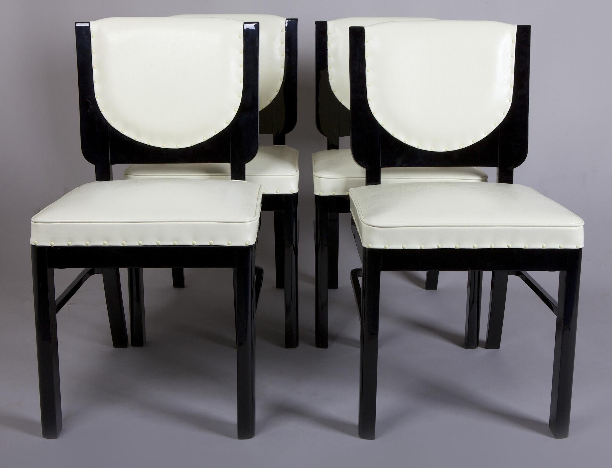 French set of chairs, four pieces
Style: Art Deco.
Period: 1920-1929. 
Material: Ebony. 
Completely restored. Surface made by black piano lacquers to the high gloss.