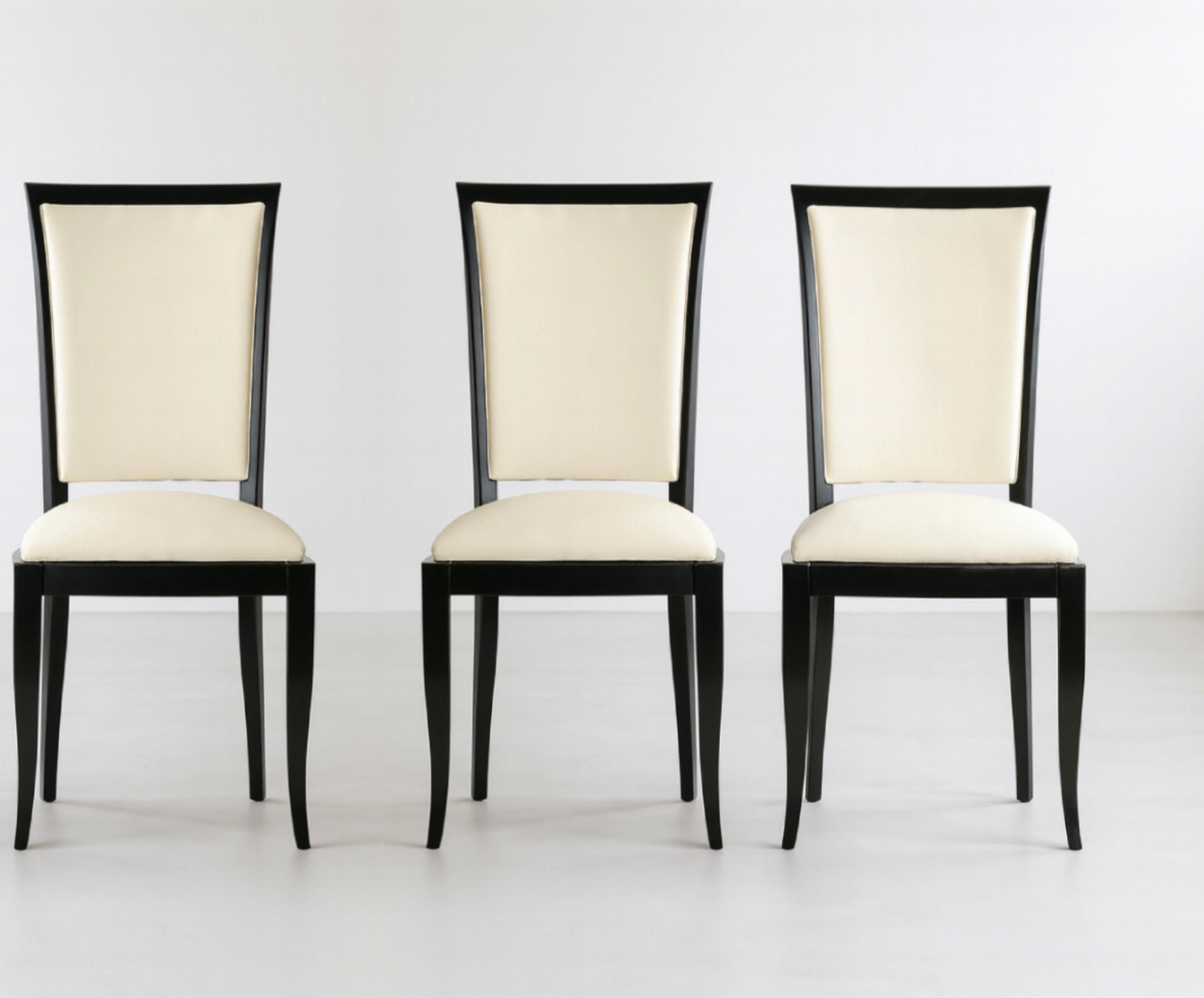 A very elegant set of four black color high gloss dining room chairs in white vinyl and polished wood finish.

We also have one more units of this piece available. Please check our listings.
