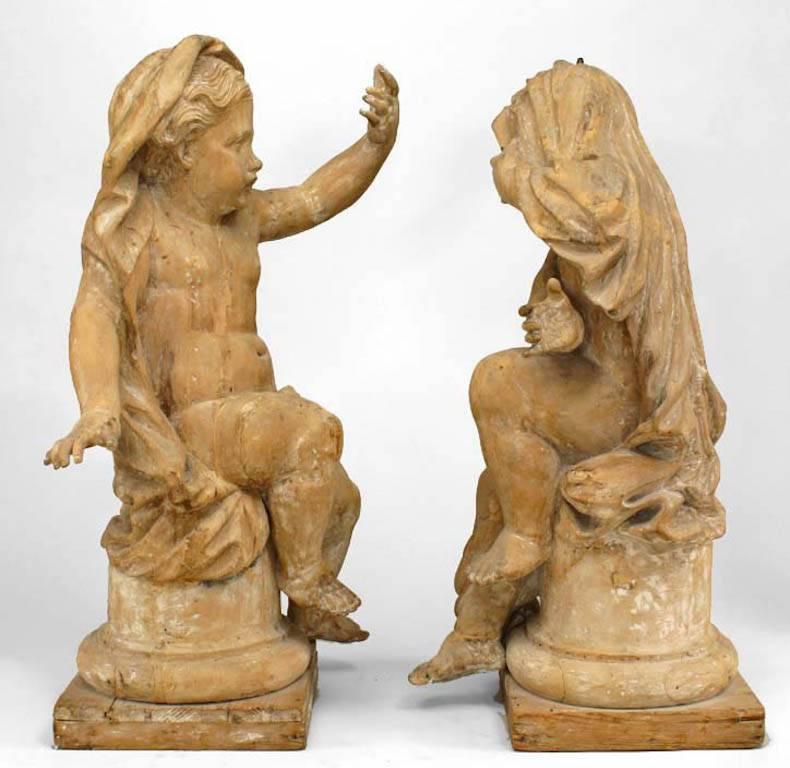 Set of 4 French Louis XVI style (18th Cent) stripped wood life-size putti depicting the four seasons sitting on socle bases. (after the marble models by Camillo Rusconi)
