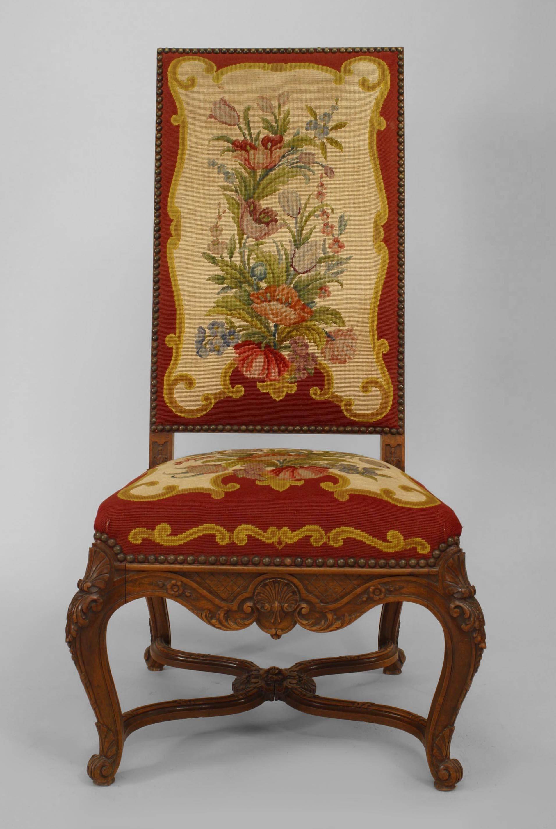 Set of 4 French Regence style (19th Cent) walnut high back side chairs with carved stretcher and upholstered red floral Aubusson seat and back.

