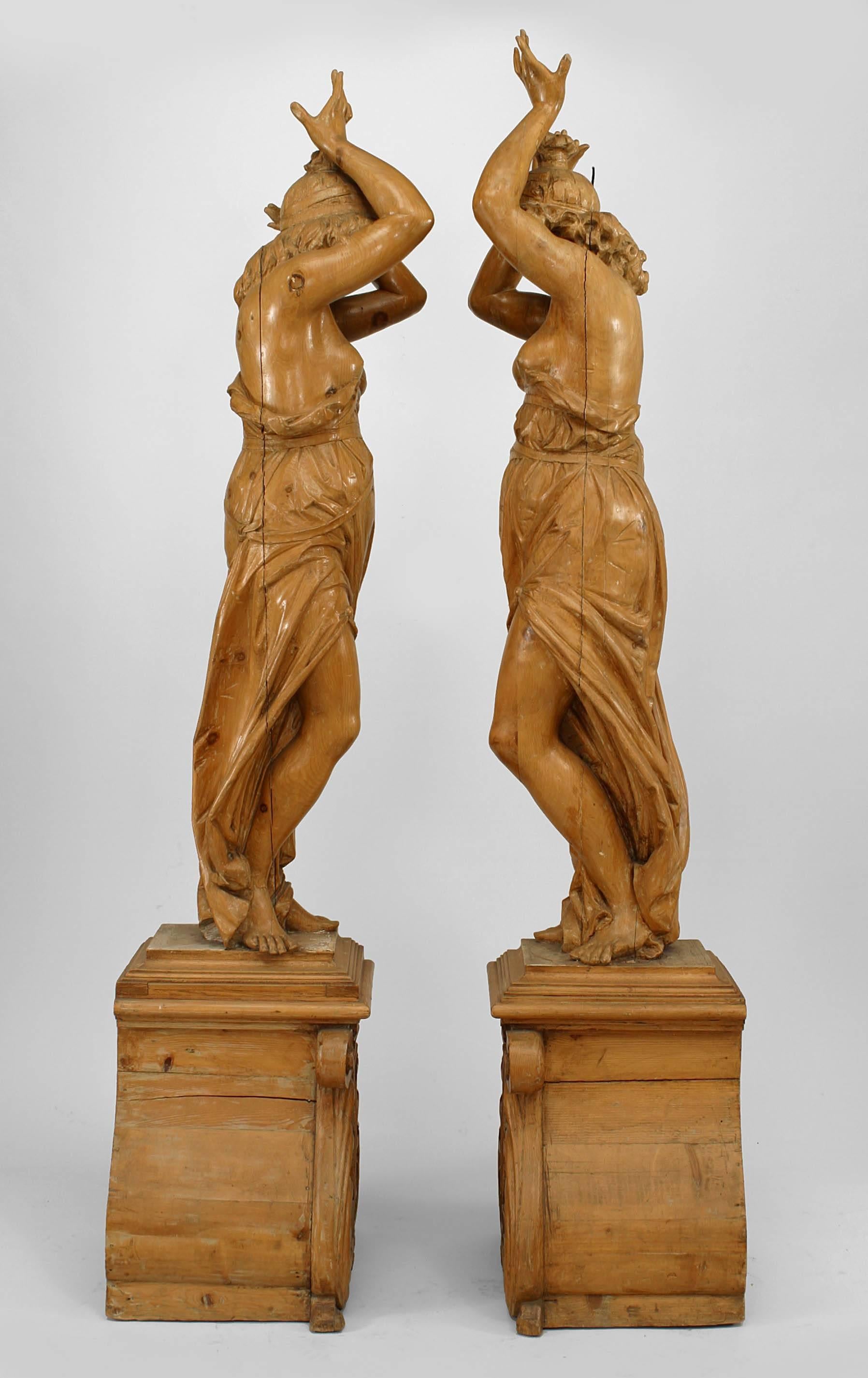 Set of 4 French Victorian pine figures of classically draped females on scroll carved base (late 19th Cent)
