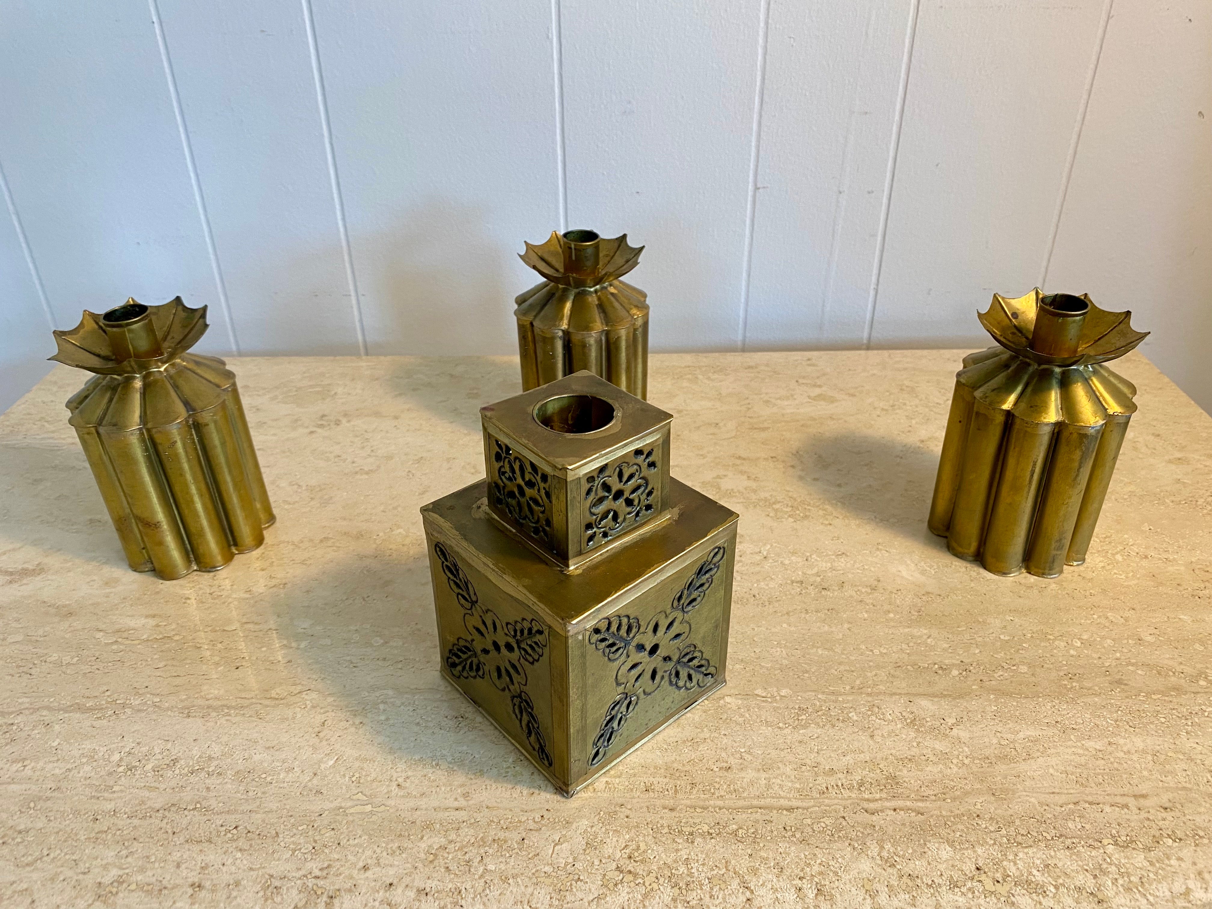 Beautiful set of 4 Mexican modernist brutalist brass candleholders by Gene Byron, circa 1960s. 
Dimensions: (3) round candleholders - 3
