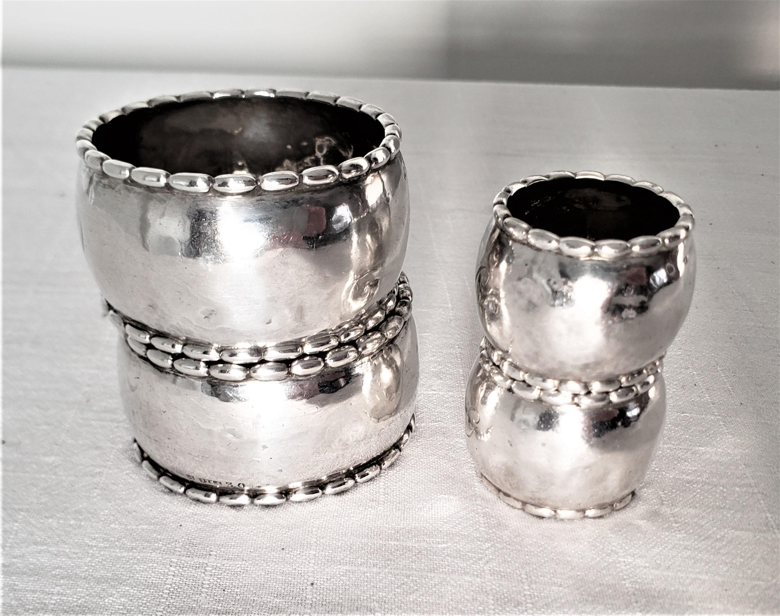 20th Century Set of 4 Georg Jensen Sterling Silver Hand Hammered Napkin Rings For Sale