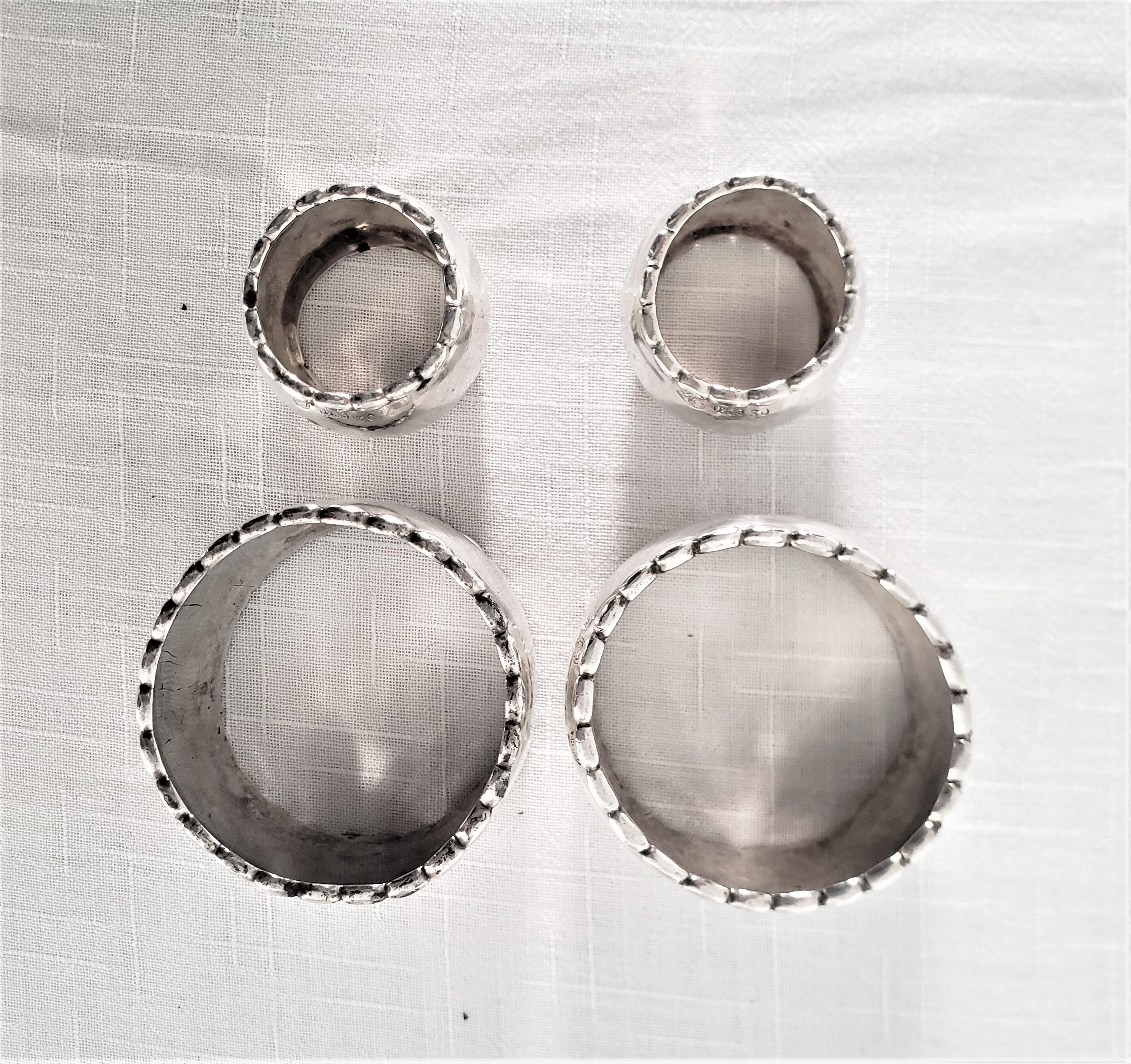 20th Century Set of 4 Georg Jensen Sterling Silver Hand Hammered Napkin Rings For Sale