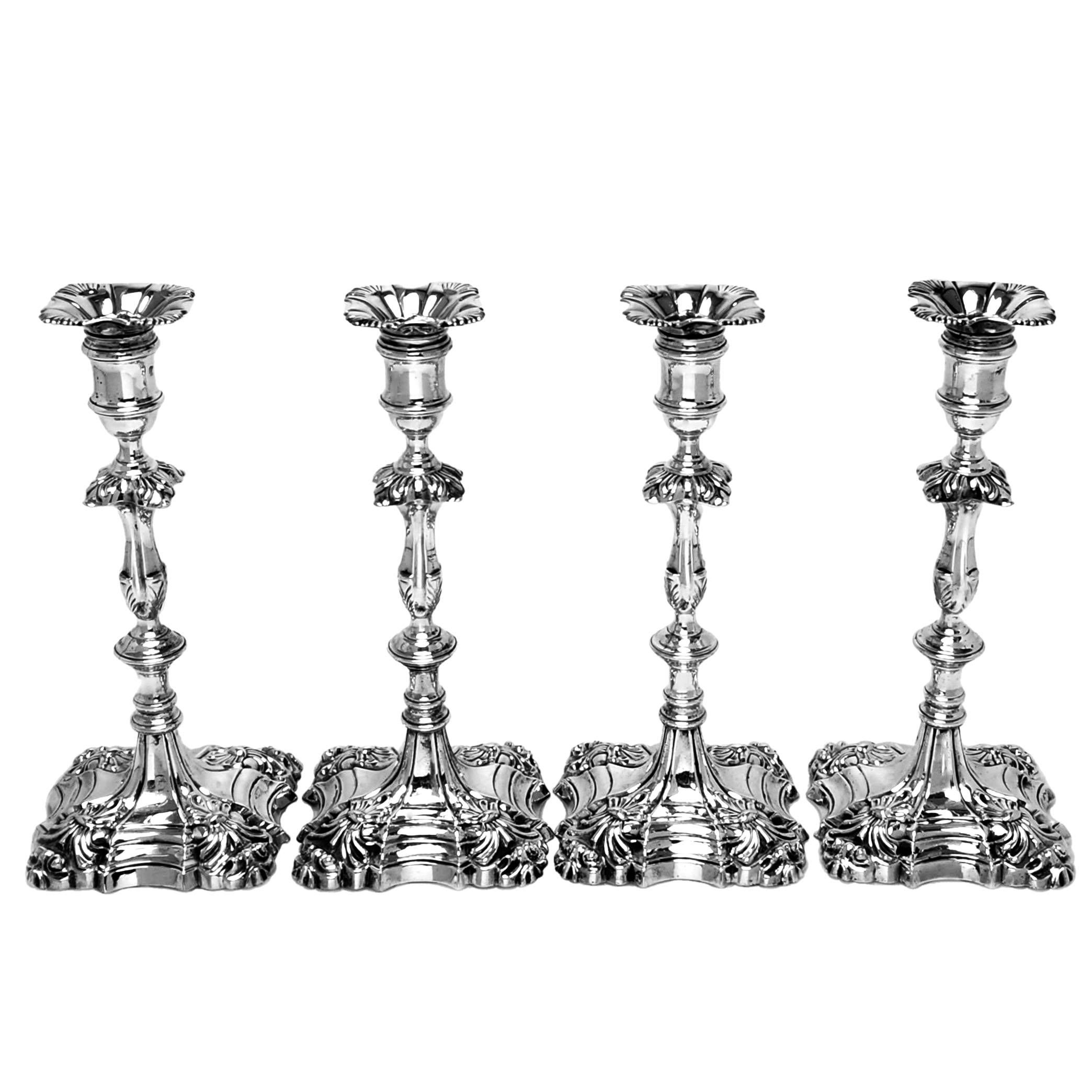 A set of 4 Antique George II Cast Silver candlesticks with elegant quatrefoil shaped square bases and knopped columns. The Candlesticks have removable sconces.

Made in London, England in 1759 in William Grundy.

Approx. Weight - 2350g /