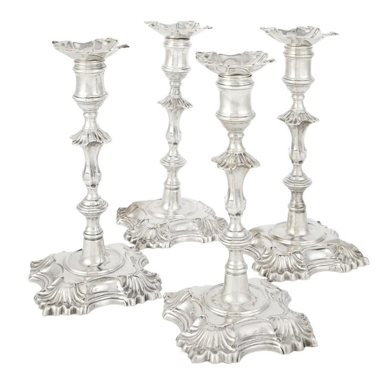 Set of 4 beautiful sterling silver candlesticks with removable bobeches. Copy of Georgian designer John Cafe from London in the 1700s. Measuring 8 inches in height and the square bases measure 4 1/4'' in length. Weight is 58 troy ounces. Hallmarked