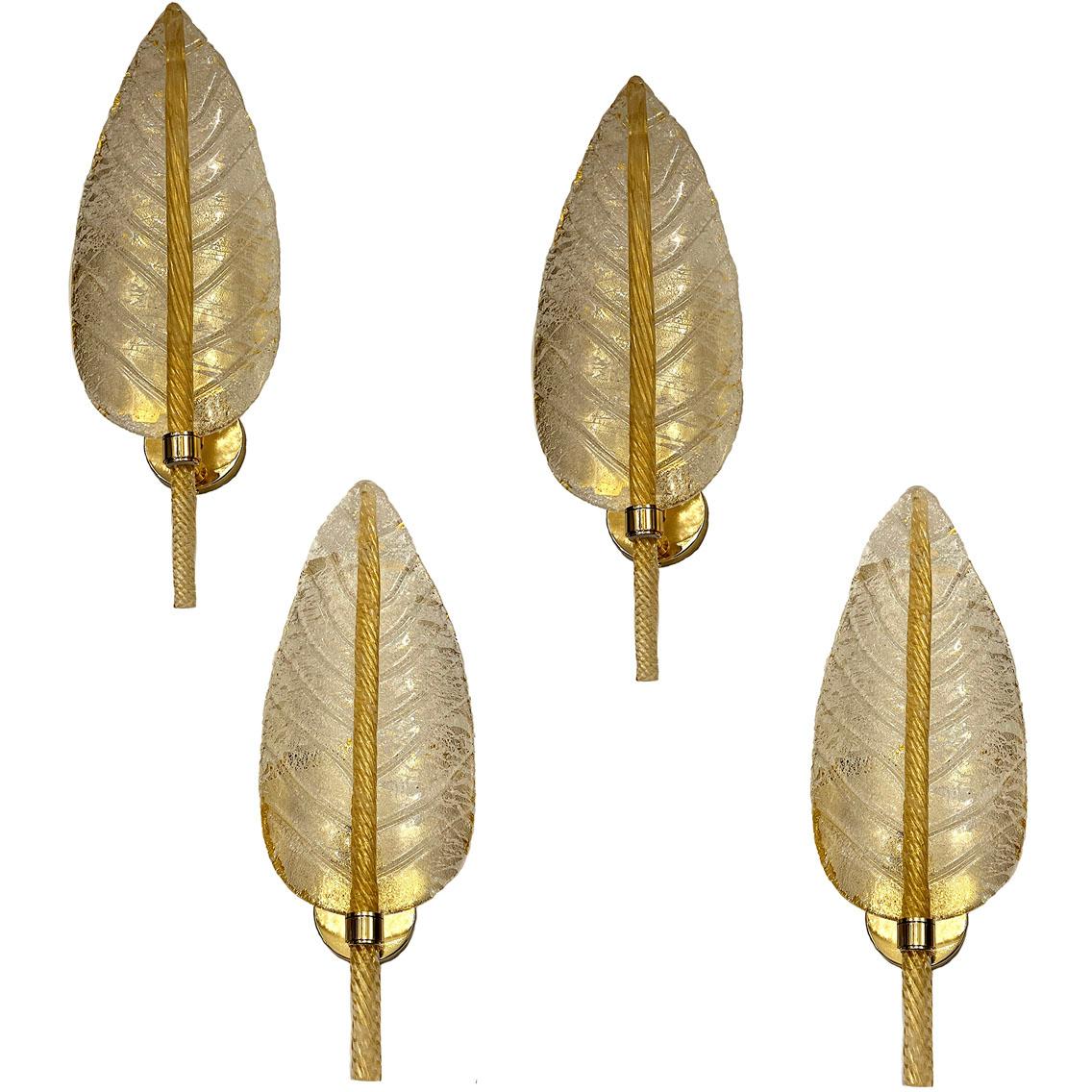 A set of 4 midcentury blown glass sconces in gold and clear glass. Sold per pair.

Measurements:
Height: 24