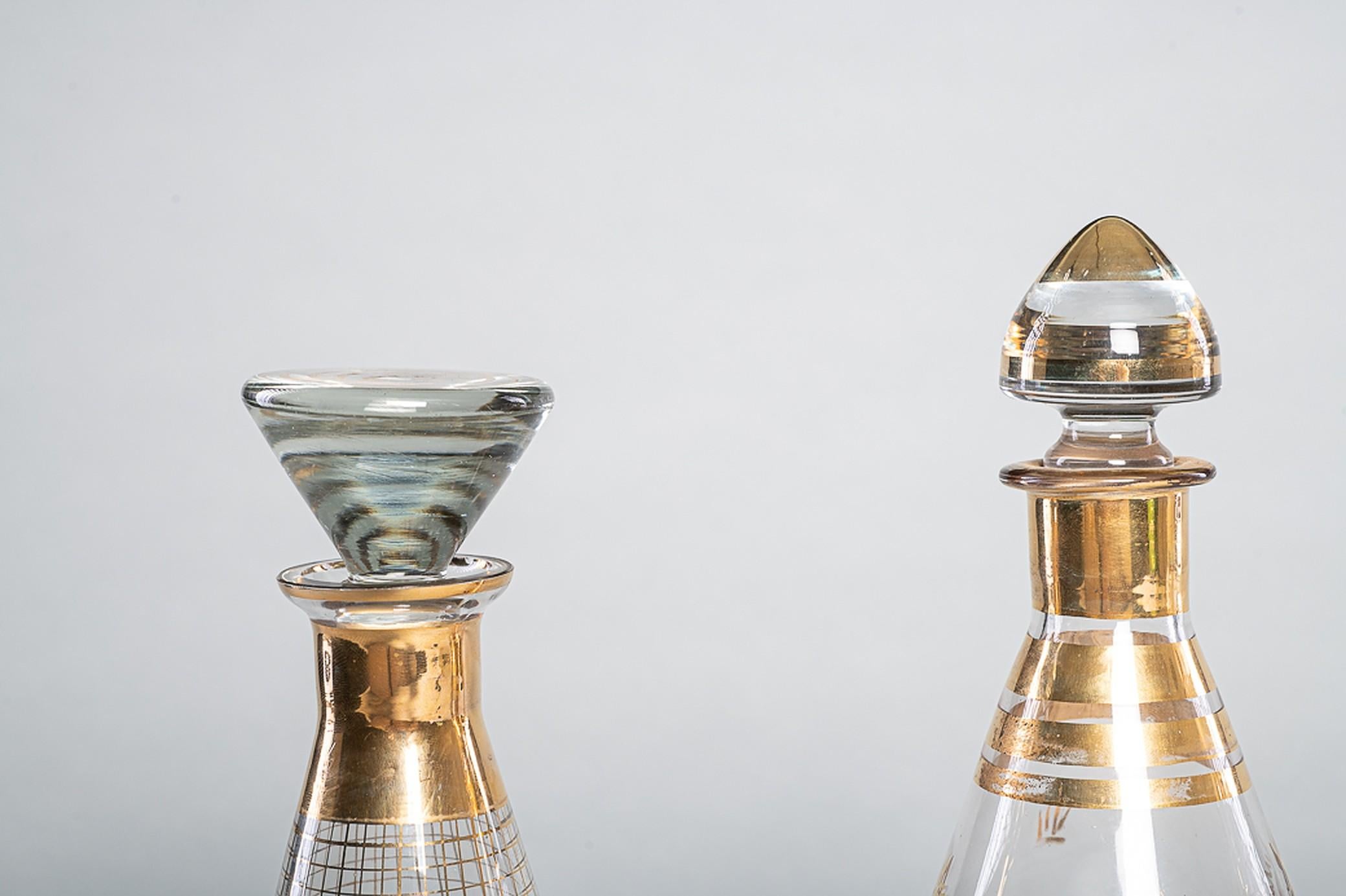 Glass liquor carafe, with gold finish / linear decoration.