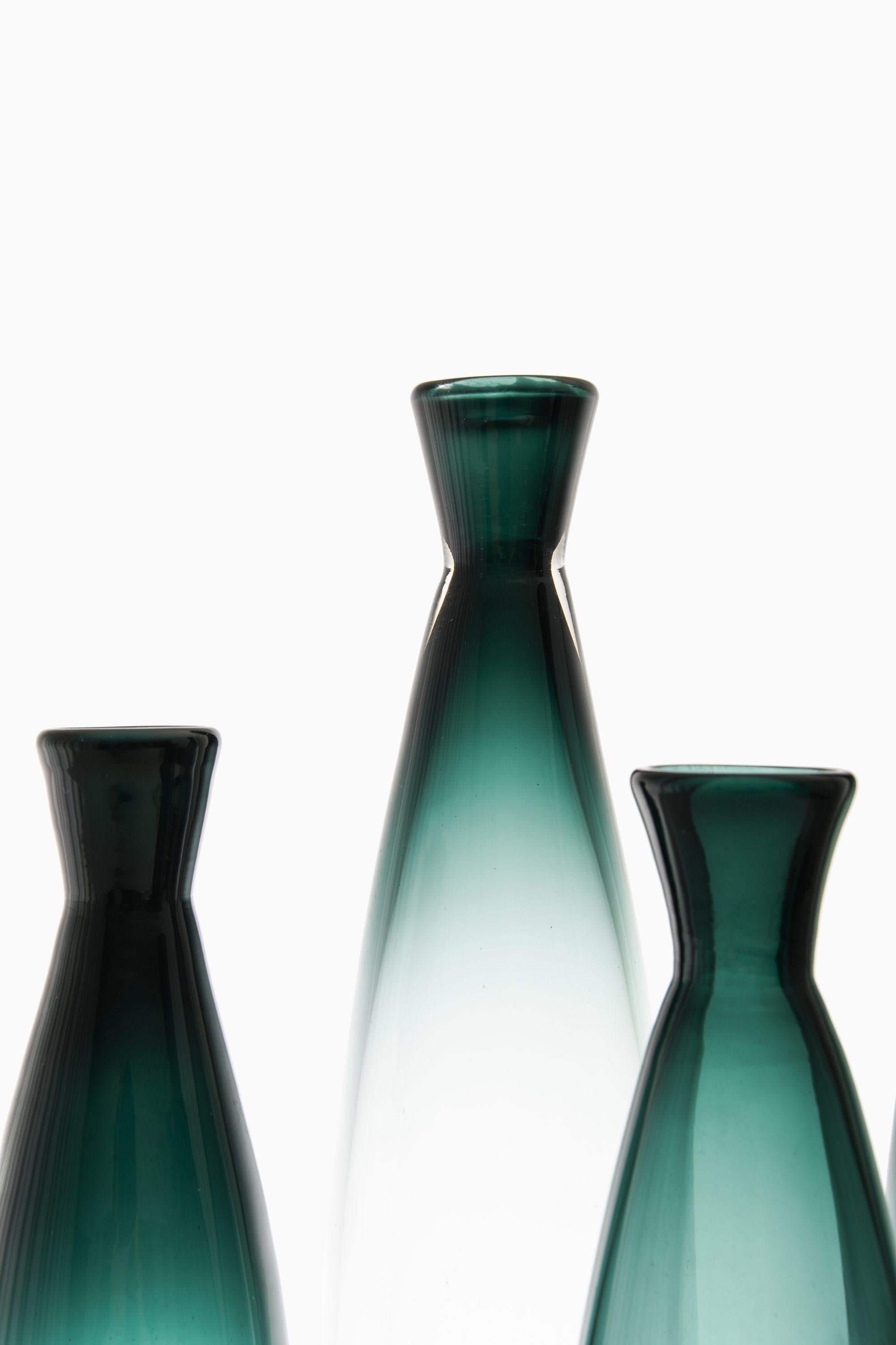 Set of 4 Glass Vases by Bengt Orup, 1960’s

Additional Information:
Material: Glass
Style: Mid century, Scandinavian
Produced by Johansfors in Sweden
Dimensions (W x D x H): 8.5 x 8.5 x 37 cm
Dimensions (W x D x H): 7.5 x 7.5 x 28 cm
Condition: Good