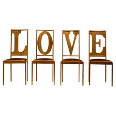 Conjunto de 4 sillas doradas Love Letters de Giulia Maria Ligresti