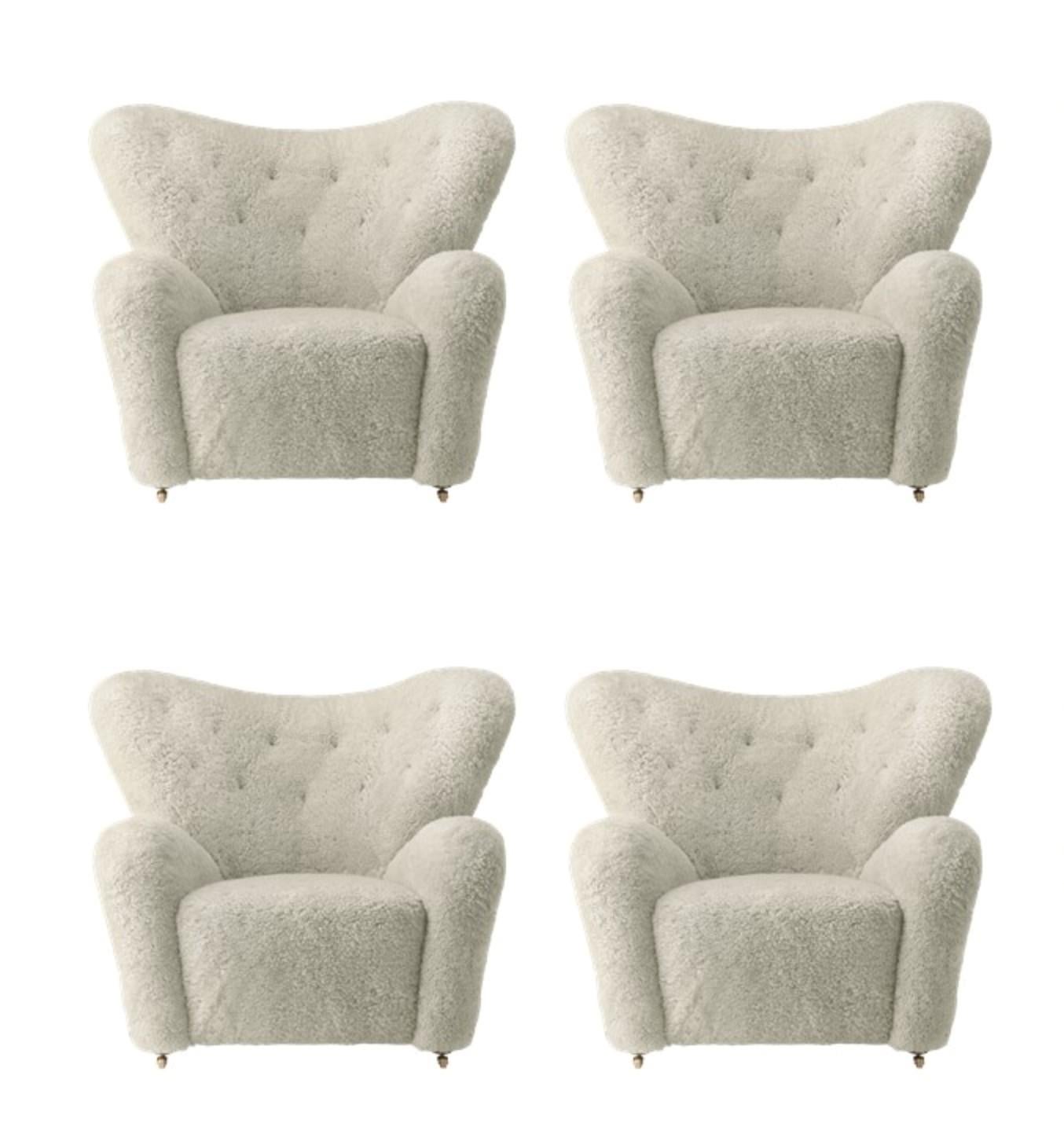 Set of 4 green tea sheepskin The Tired Man lounge chair by Lassen.
Dimensions: W 102 x D 87 x H 88 cm 
Materials: Sheepskin

Flemming Lassen designed the overstuffed easy chair, The Tired Man, for The Copenhagen Cabinetmakers’ Guild Competition