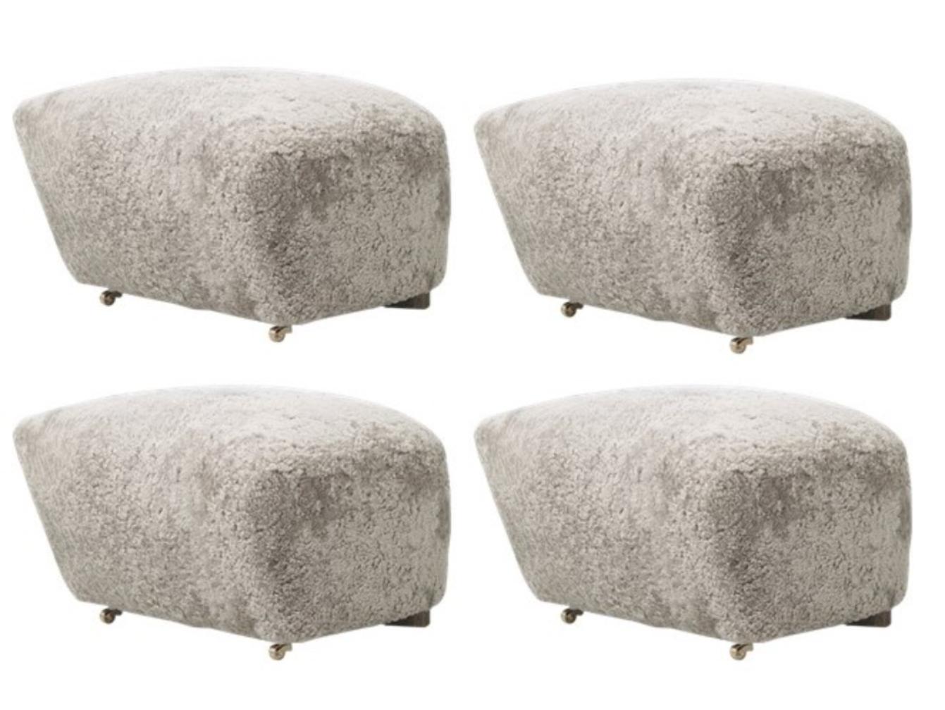 Set Of 4 green tea smoked oak sheepskin the tired man footstools by Lassen.
Dimensions: W 55 x D 53 x H 36 cm 
Materials: Sheepskin

Flemming Lassen designed the overstuffed easy chair, the tired man, for the copenhagen cabinetmakers’ guild