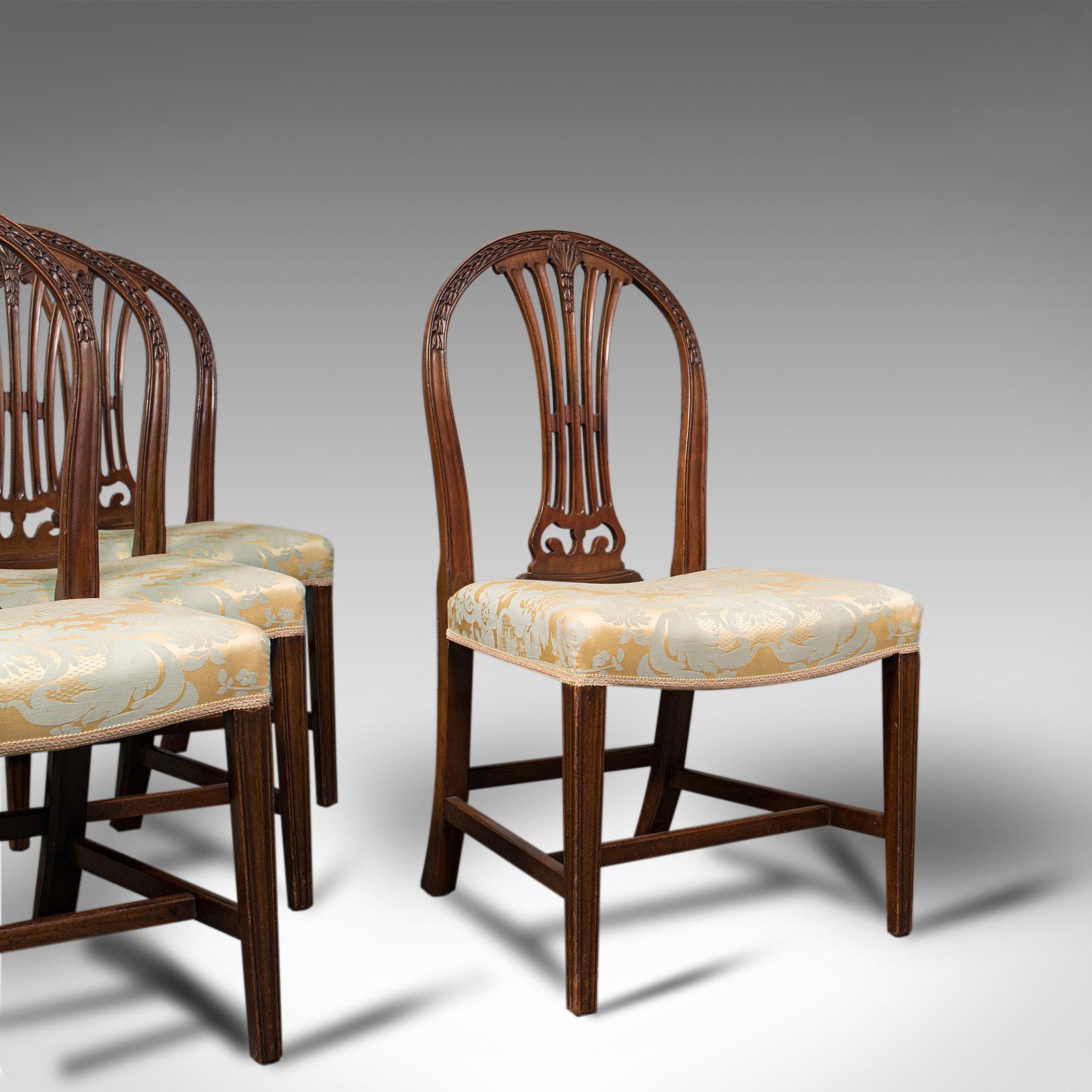 This is a set of 4 Hepplewhite revival chairs. An English, mahogany dining suite, dating to the late Victorian period, circa 1890.

Delightfully graceful frames and attractive upholstery
Displaying a desirable aged patina
Select mahogany shows