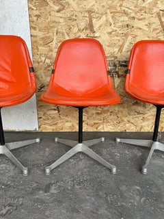 Set of 4 Herman Miller Eames Orange Pad Swivel PKC1 aluminum base Dining Chairs