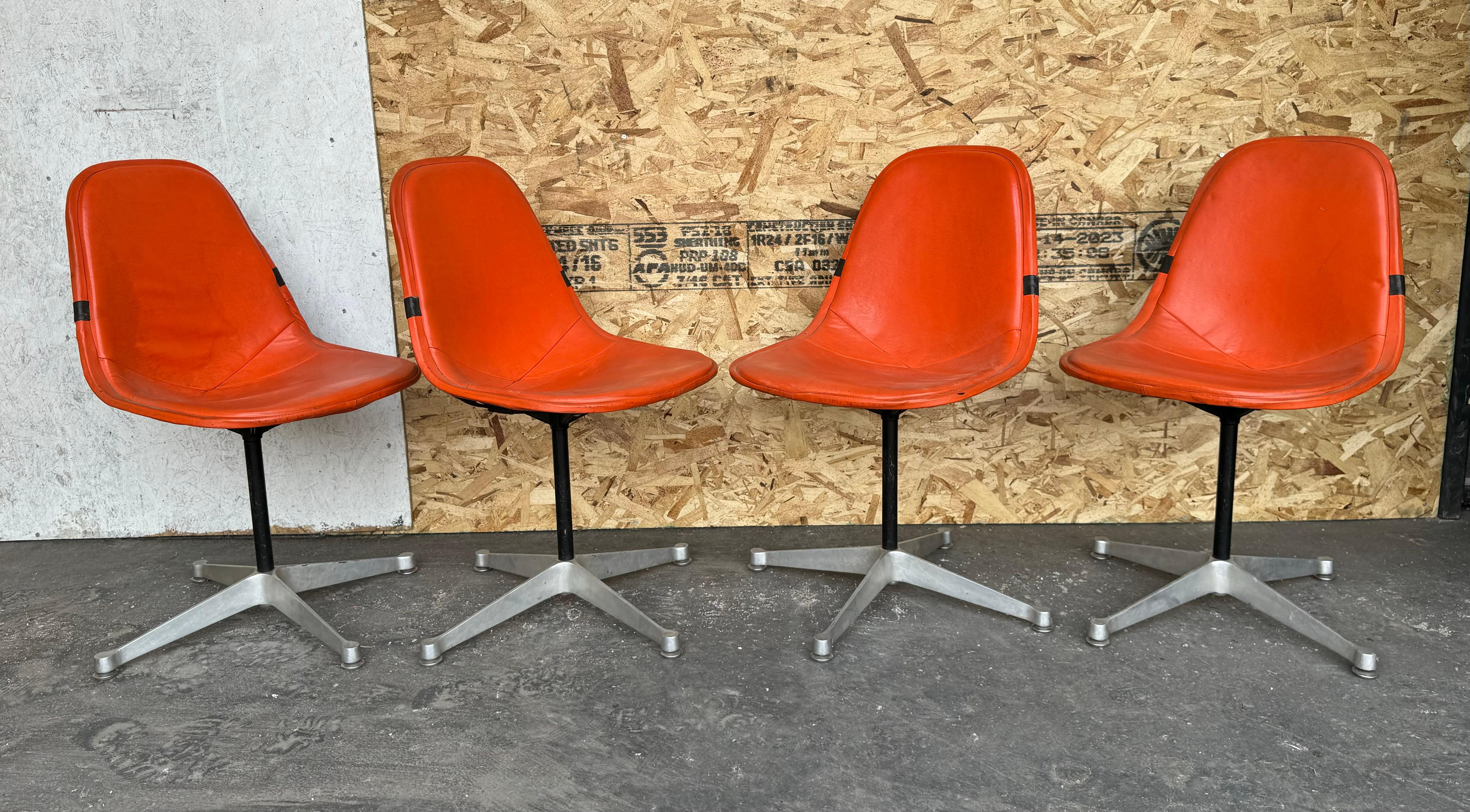 Mid-20th Century Set of 4 Herman Miller Eames Orange Pad Swivel PKC1 aluminum base Dining Chairs For Sale