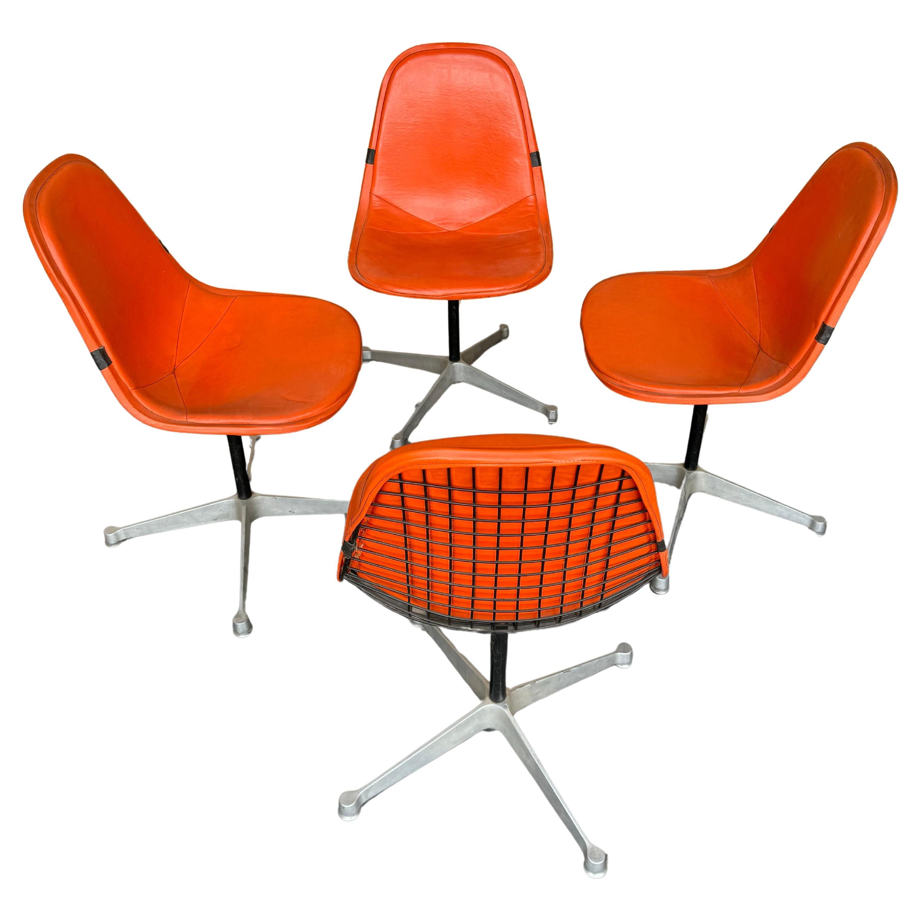 Set of 4 Herman Miller Eames Orange Pad Swivel PKC1 aluminum base Dining Chairs For Sale