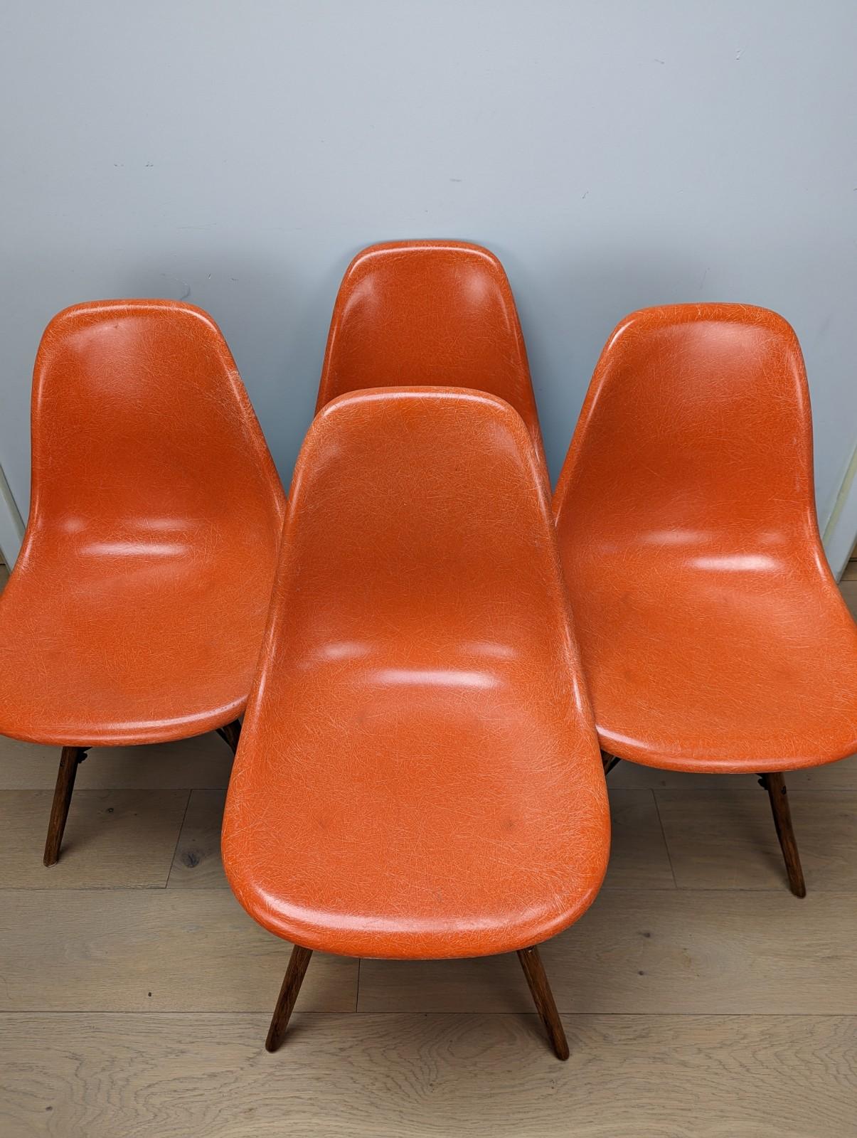 Set of 4 Herman Miller Fiberglass Eames DSW Chairs in orange

The chairs shells were made on the 24th April 1972 and all chairs have the associated stamps underneath. The shells and stamps are both excellent condition. There are no cracks and are