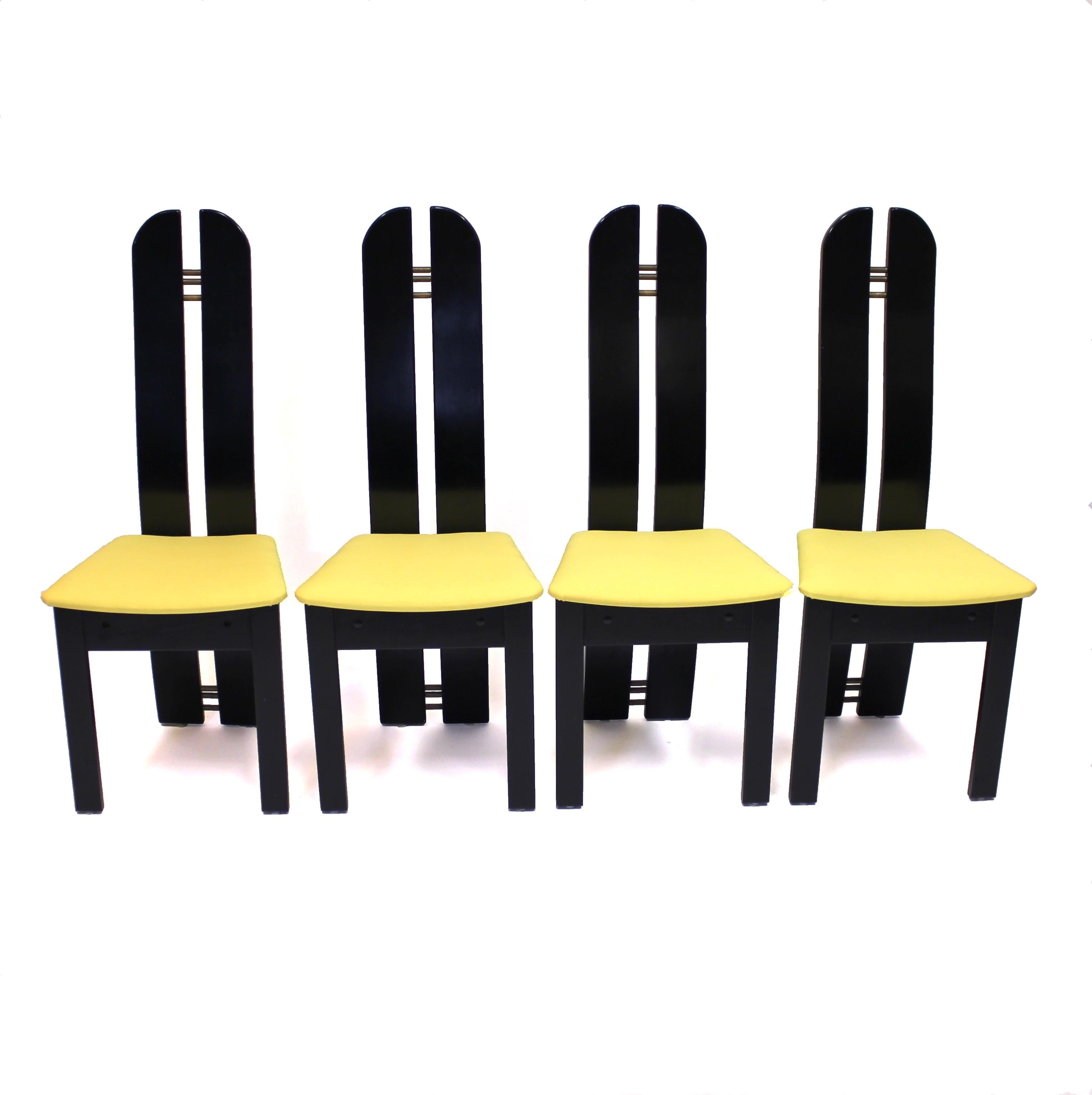 Set of 4 high back postmodern chairs, made by Danish company Mørkøv Møbelindustri ApS who is still operating today. Produced and designed in the 1980s. Made of black lacquered wood and newly upholstered seats in a bright yellow fabric, very