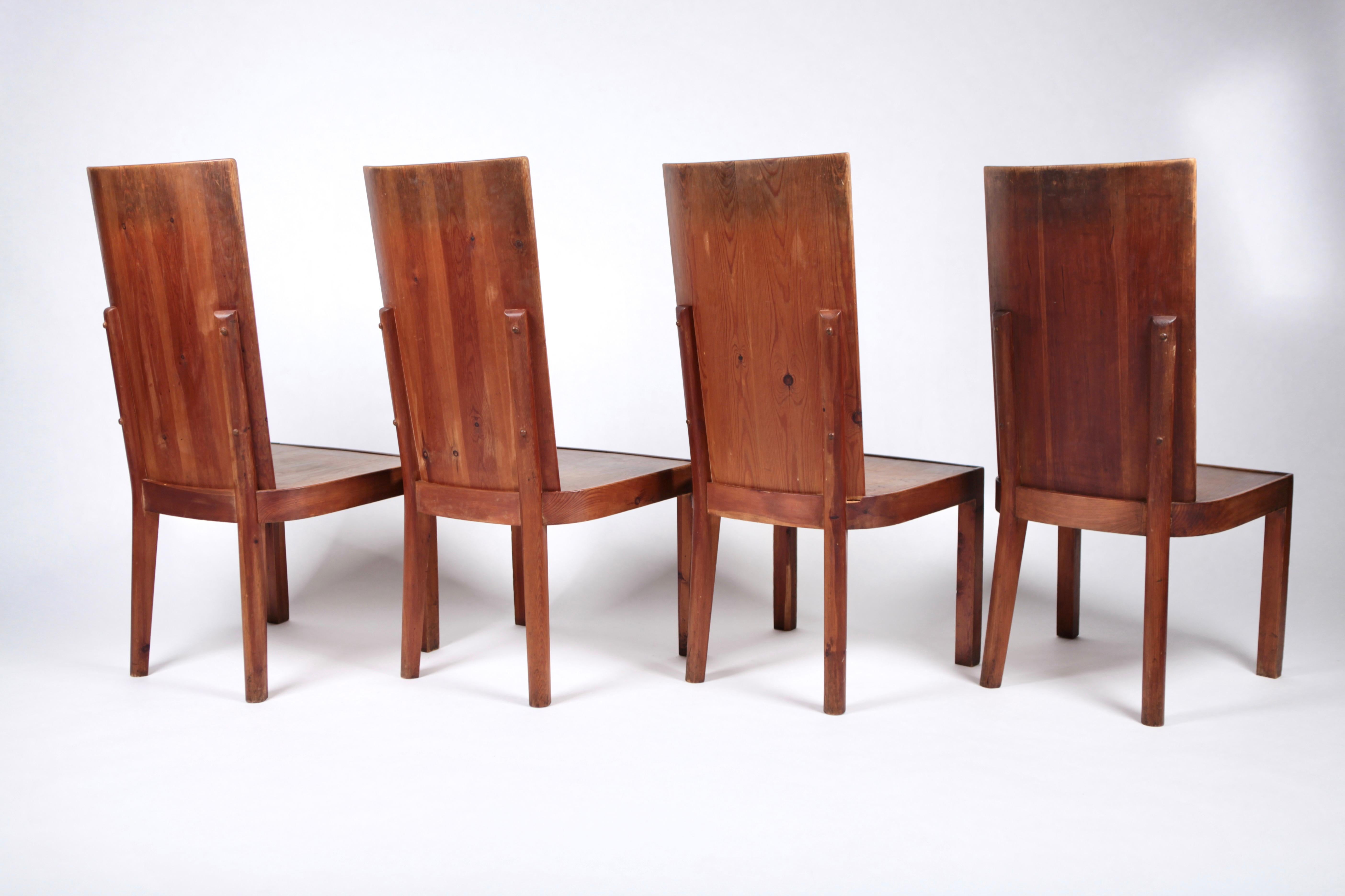 Set of 4 dining chairs in acid stained pine, attributed to Axel Einar Hjorth, model Lovö, Sweden 1930s.