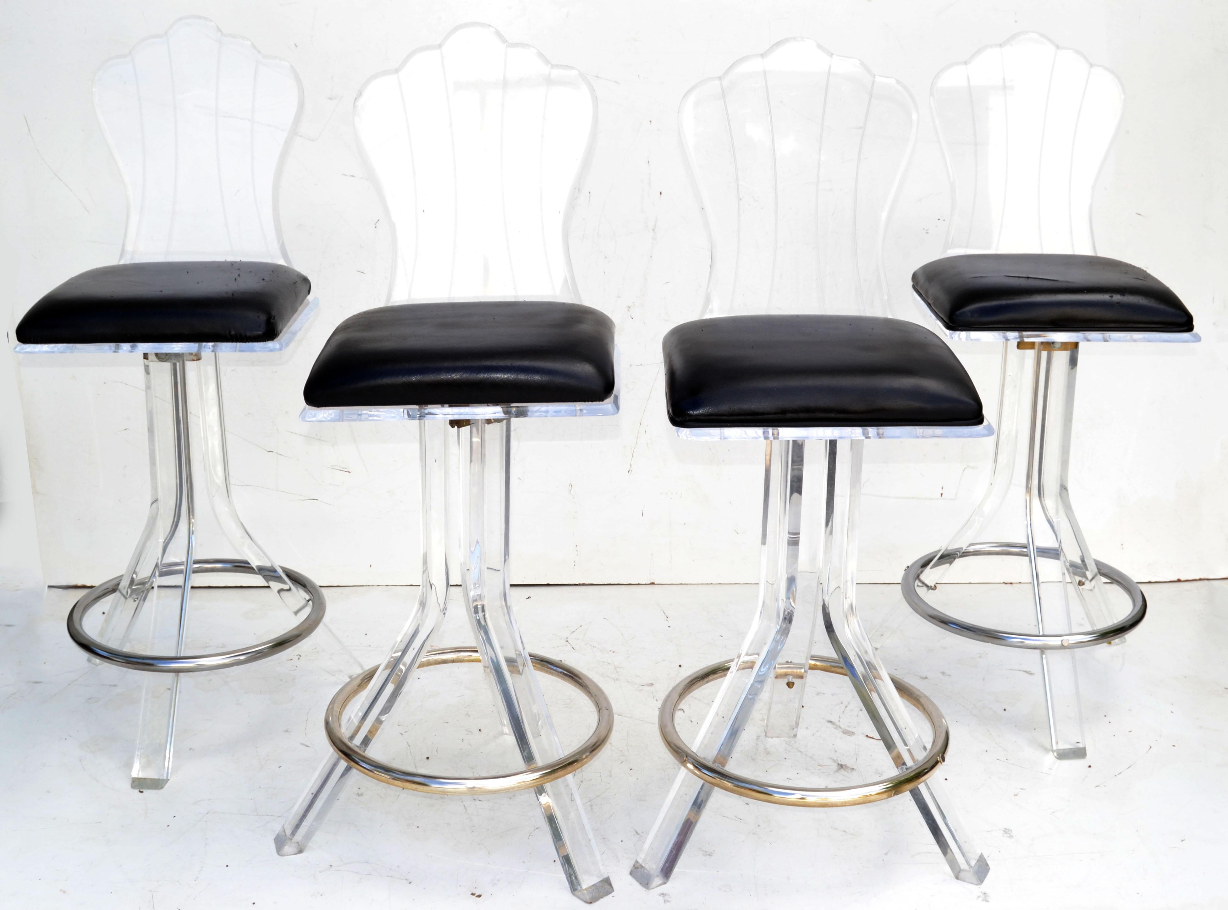 Exceptional Mid-Century Modern fantastic and rare set of four Lucite 3 legged swivel bar stools with Chrome Round Footrest by Hill Manufacturers made in America in the 1970s.
Footrest Height: 7 inches.
In original vintage condition.
The black