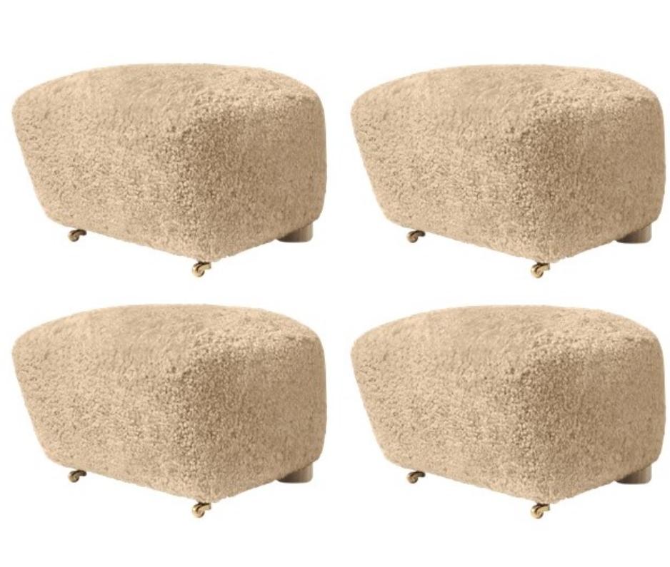 Set of 4 honey natural oak sheepskin the tired man footstools by Lassen
Dimensions: W 55 x D 53 x H 36 cm 
Materials: Sheepskin

Flemming Lassen designed the overstuffed easy chair, The Tired Man, for The Copenhagen Cabinetmakers’ Guild