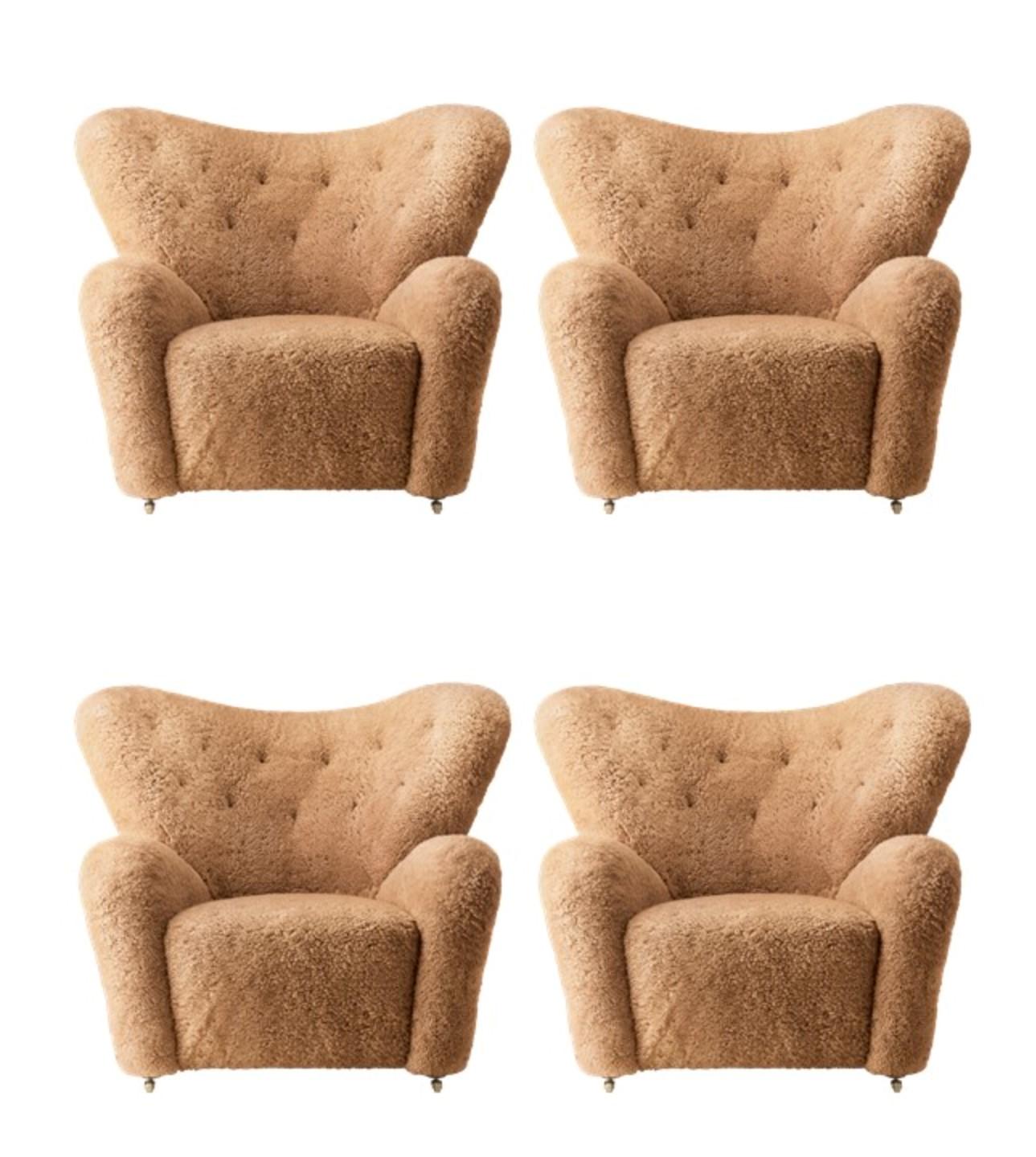 Set of 4 Honey Sheepskin The Tired Man lounge chair by Lassen
Dimensions: W 102 x D 87 x H 88 cm 
Materials: Sheepskin

Flemming Lassen designed the overstuffed easy chair, The Tired Man, for The Copenhagen Cabinetmakers’ Guild Competition in