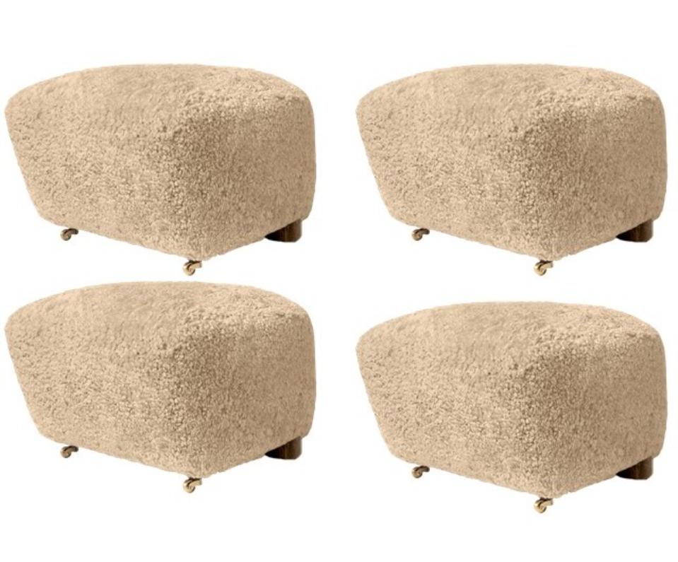 Set of 4 honey smoked oak sheepskin the tired man footstools by Lassen
Dimensions: W 55 x D 53 x H 36 cm 
Materials: sheepskin

Flemming Lassen designed the overstuffed easy chair, The Tired Man, for The Copenhagen Cabinetmakers’ Guild