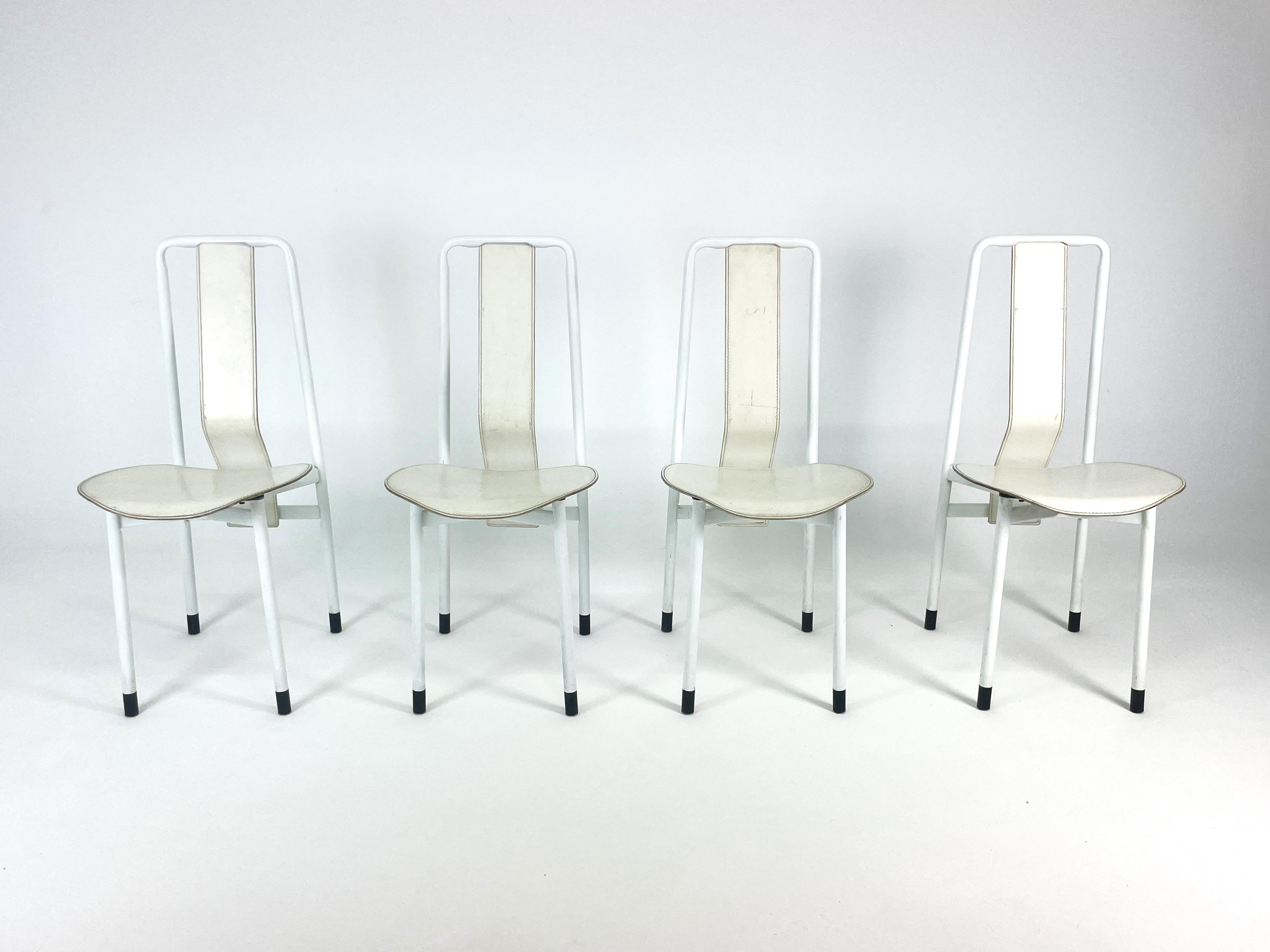 The Irma Chair set, designed by Achille Castiglioni for Zanotta in 1979, exemplifies the designer's innovative approach to form and function. Each chair in this collection features sleek white leather upholstery paired with a sturdy metal frame,