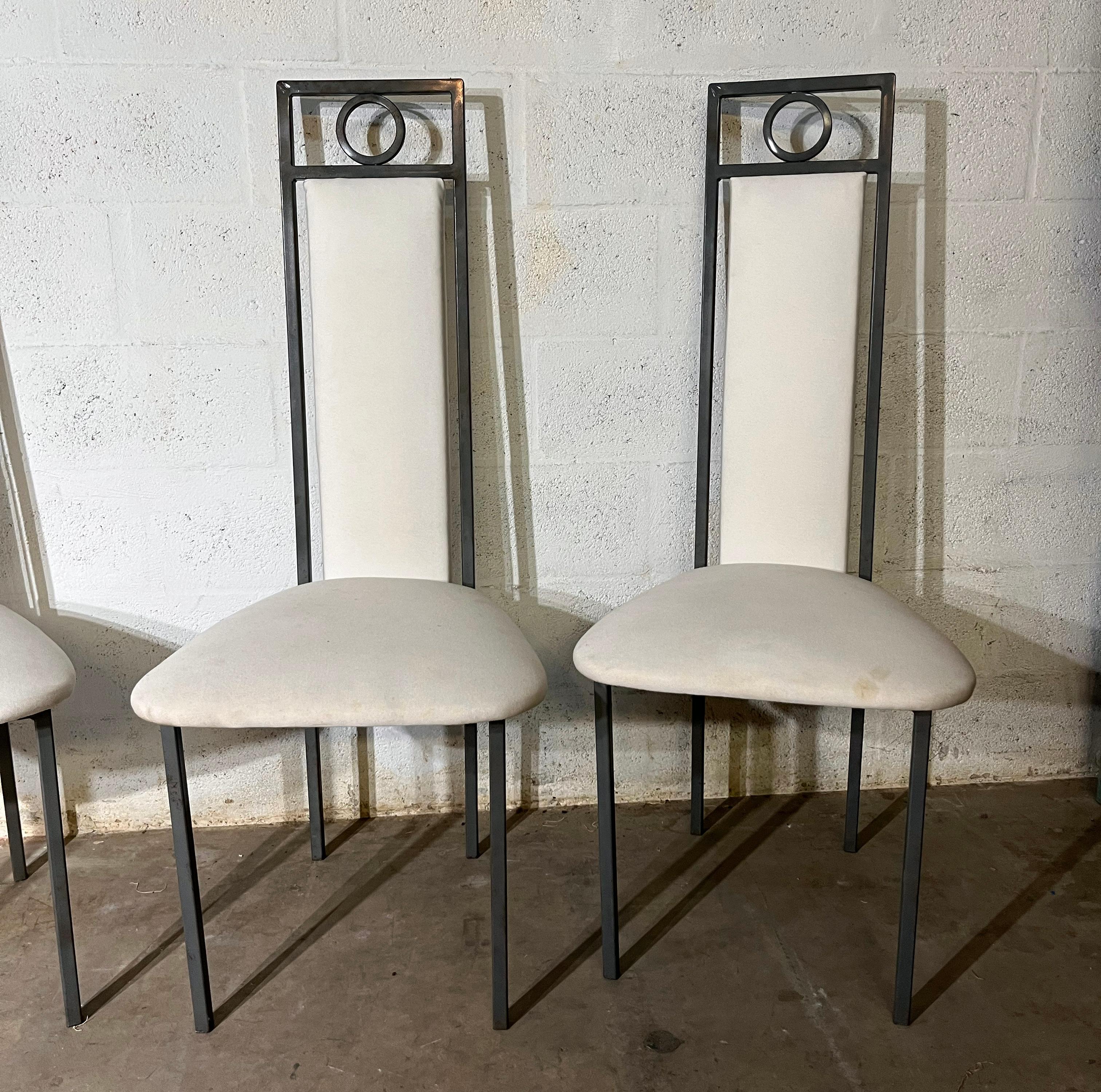 Mid century set of 4 metal   chairs .

