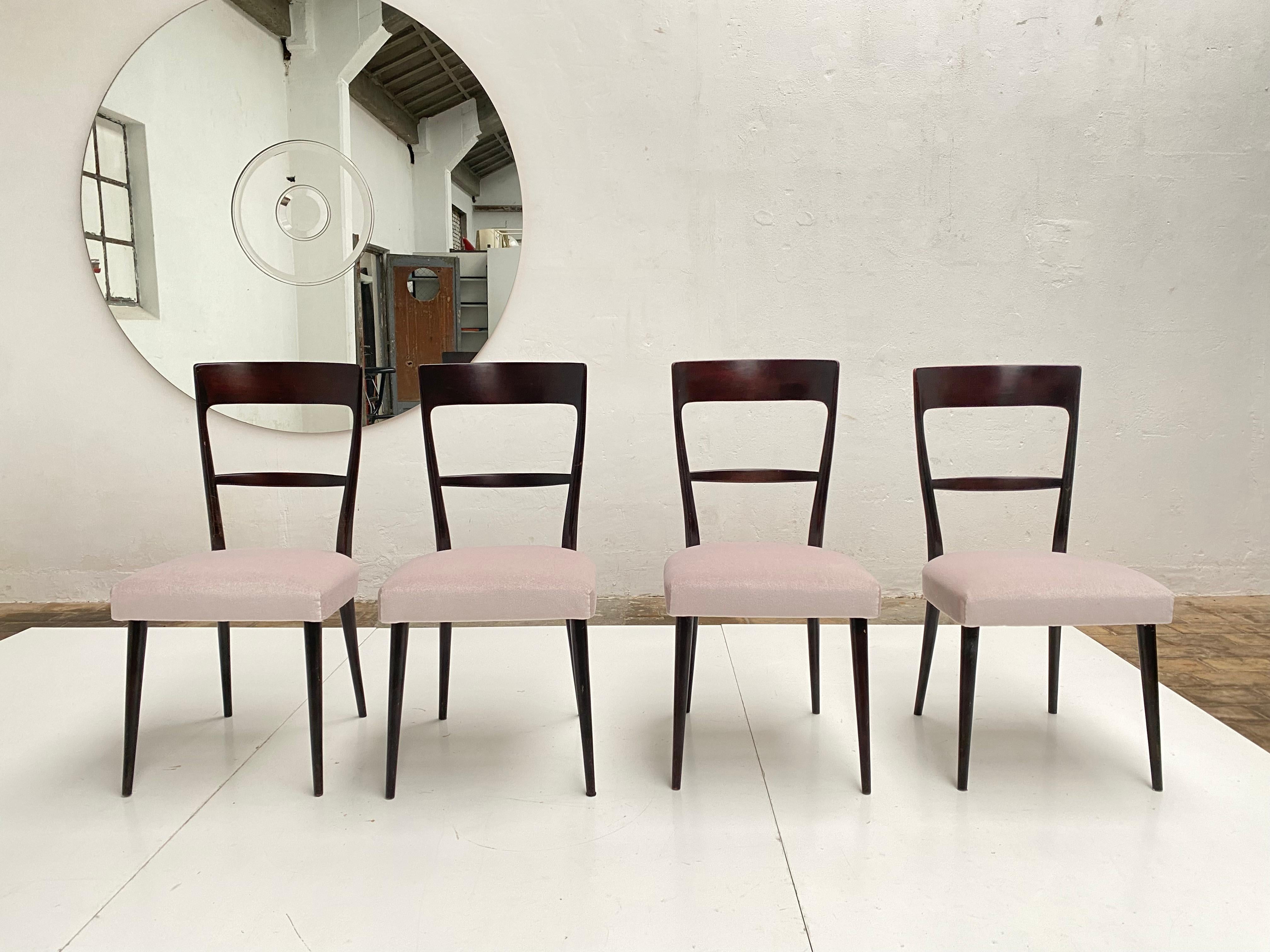 Set of 4 Italian 1950s dining chairs in dark mahogany stained ash or beechwood.

This set has been restored with new 