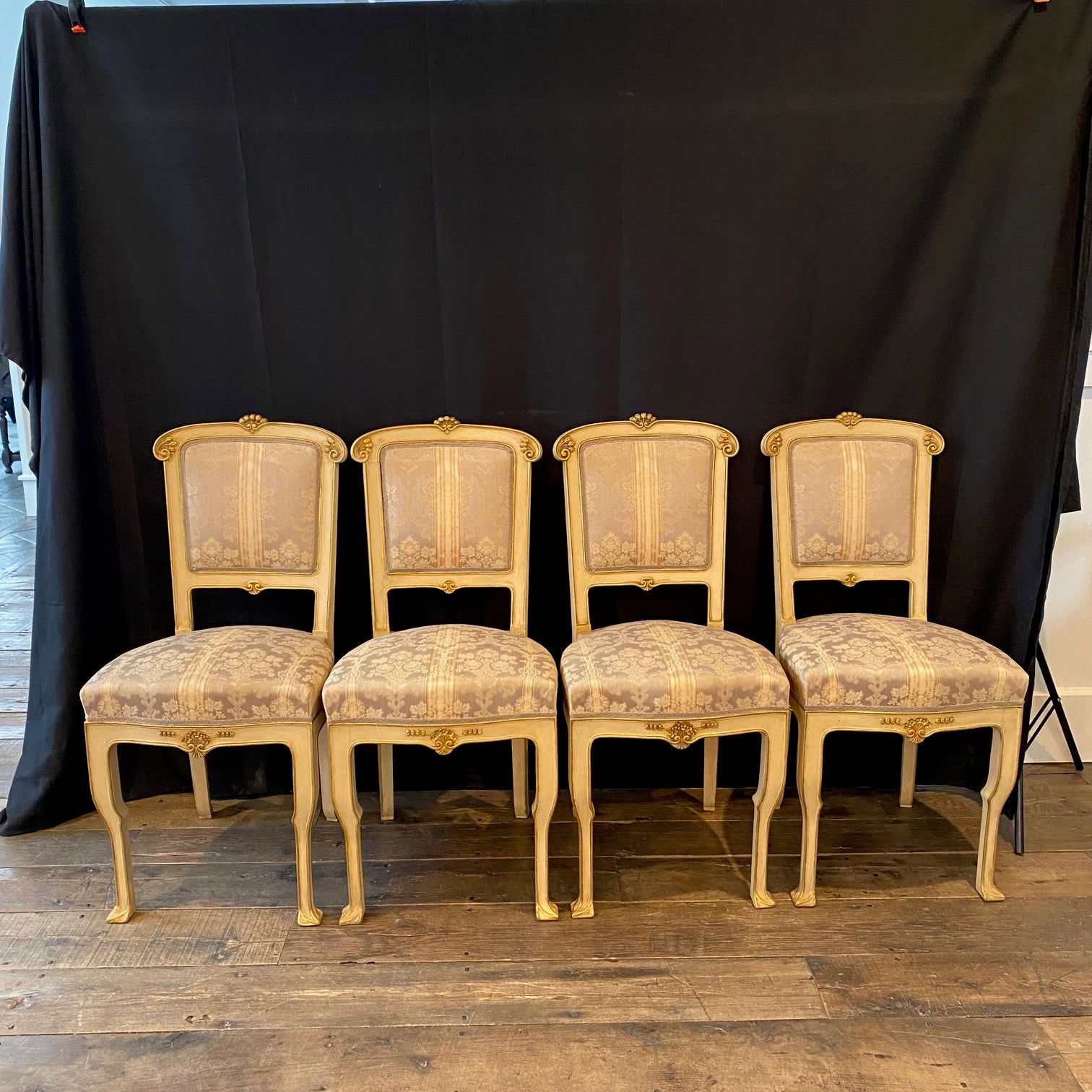 Set of four lovely and elegant Art Nouveau Italian side chairs, dining chairs or accent chairs, all with beautiful original muted striped damask fabric.  Part of a 10-piece Art Nouveau complete original salon suite set hand carved and painted with