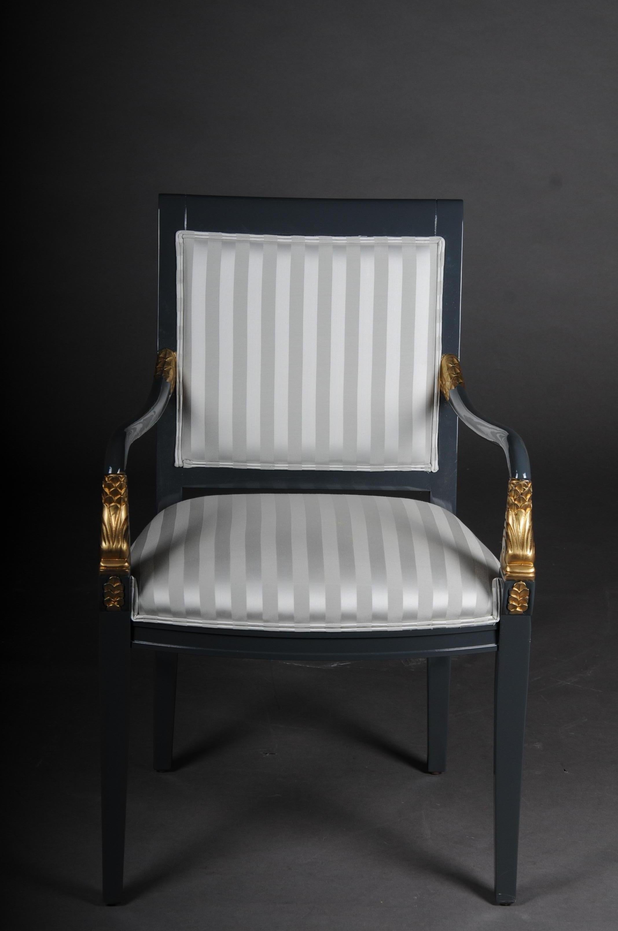 Set of 4 Italian designer armchairs Empire style, 20th century

Solid wood frame, painted dark gray, partly decorated with gold. With dolphin application. Extremely high quality workmanship. Upholstered seat made of high quality fabric. Seat and