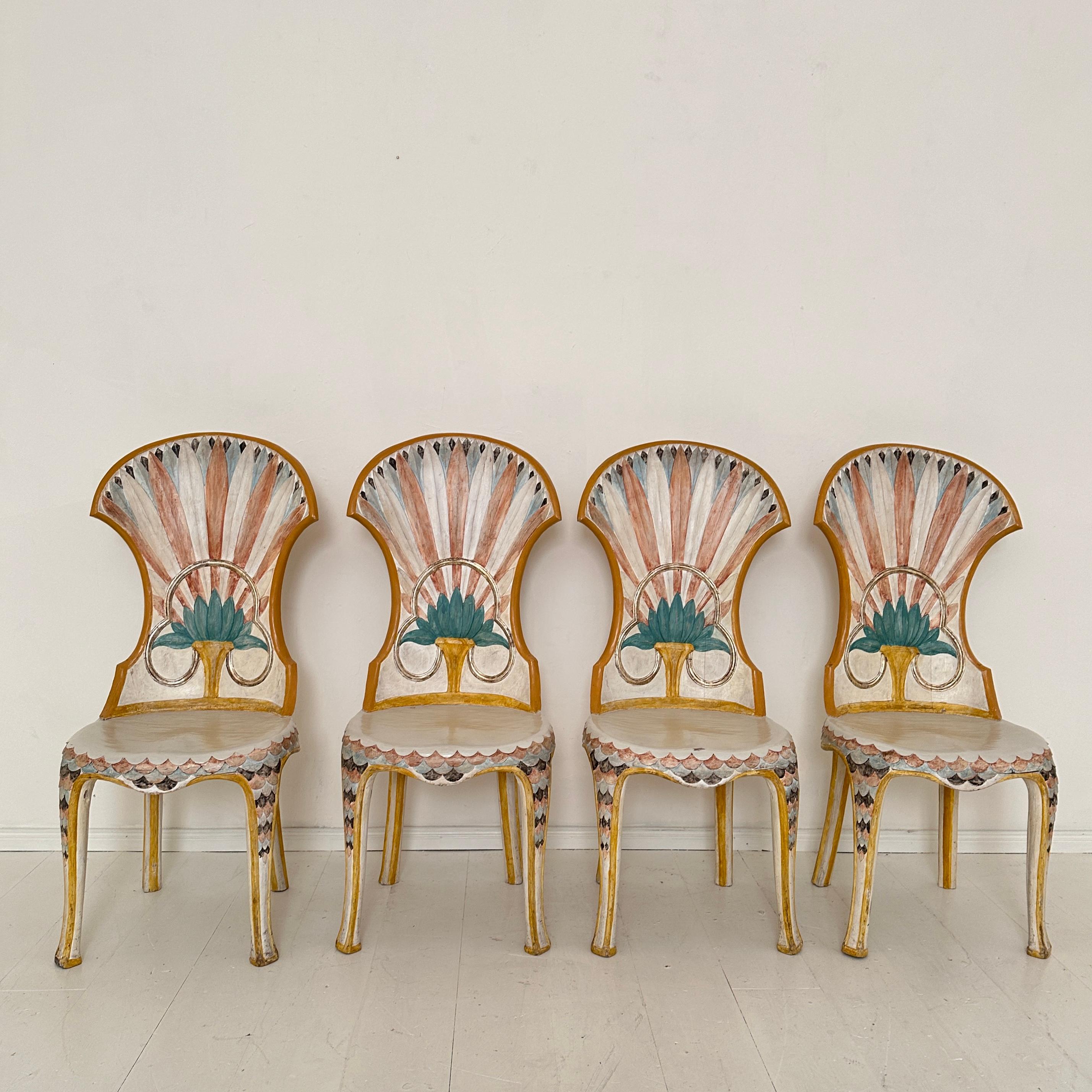 This exquisite set of 4 Italian dining chairs, crafted by the renowned Bartolozzi and Maioli in Florence during the 1970s, embodies the elegance of Egyptian Revival artistry. Hand-carved and hand-painted, each chair features intricate detailing