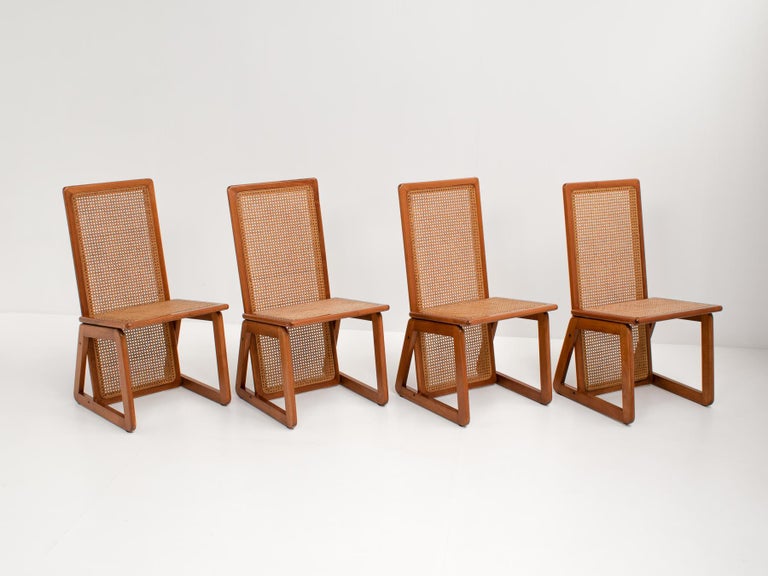 A beautiful set of 4 Italian high-back dining chairs.

The chairs are a perfect combination between design and comfort, because of their high backs. This makes that the chairs can actually be used and do not only serve as an eye-catcher! 

They have