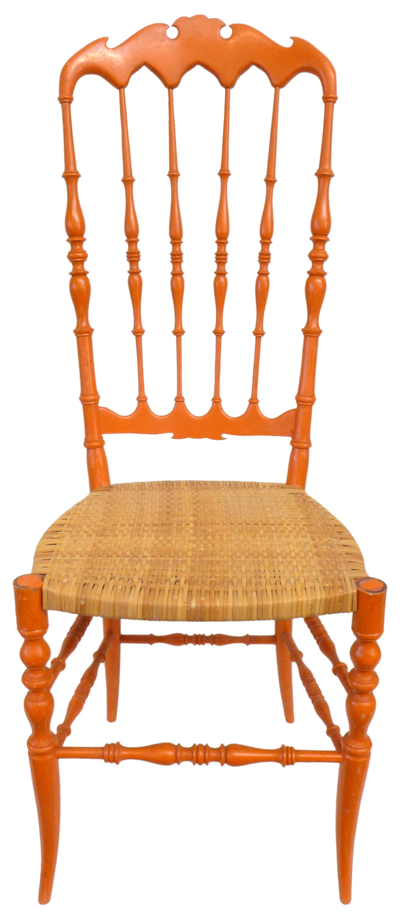 An elegant set of 4 Italian Chiavari dining chairs. Intricate turned and carved wood frames painted in a fetching orange with seats of finely woven cane. Strong, though slim and lightweight. Impressive craftsmanship and great from all angles. A