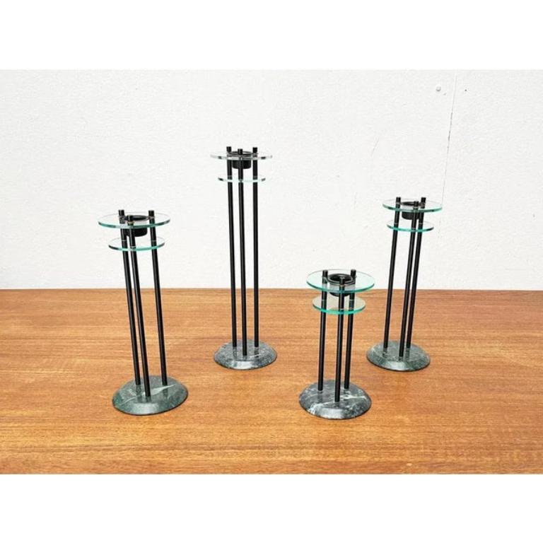 Italian Postmodern Milano Series Candleholders, 1980s, Set of 4, in Very Good conditions. Designed 1980 to 1989 This piece has an attribution mark.

Additional information:
Material: Metal, Plastic
Color: Black
Country of Origin: Italy
Item Type: