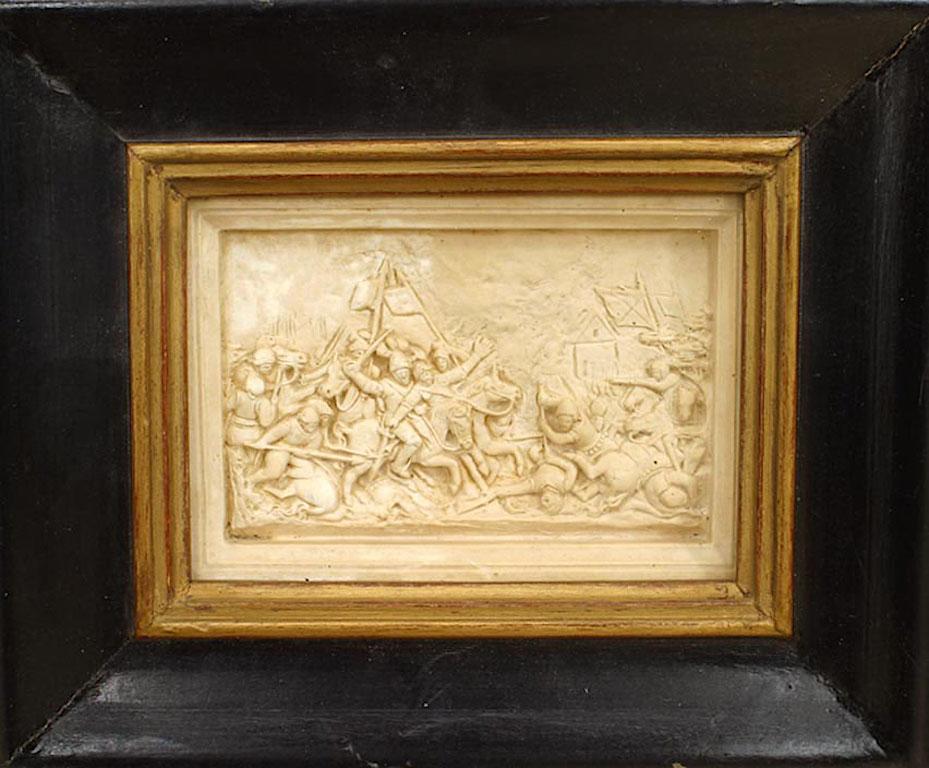 4 Italian Renaissance style (19th Century) carved soapstone wall plaques of Medieval scenes under glass in black frames.
