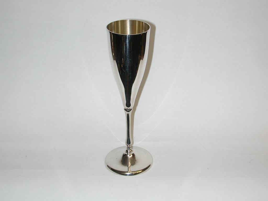 Set of 4 Italian silver champagne flutes, Dated Circa 1960
Weighing 14.4 troy ounces of 800 standard silver.
Modern style with gilding inside.