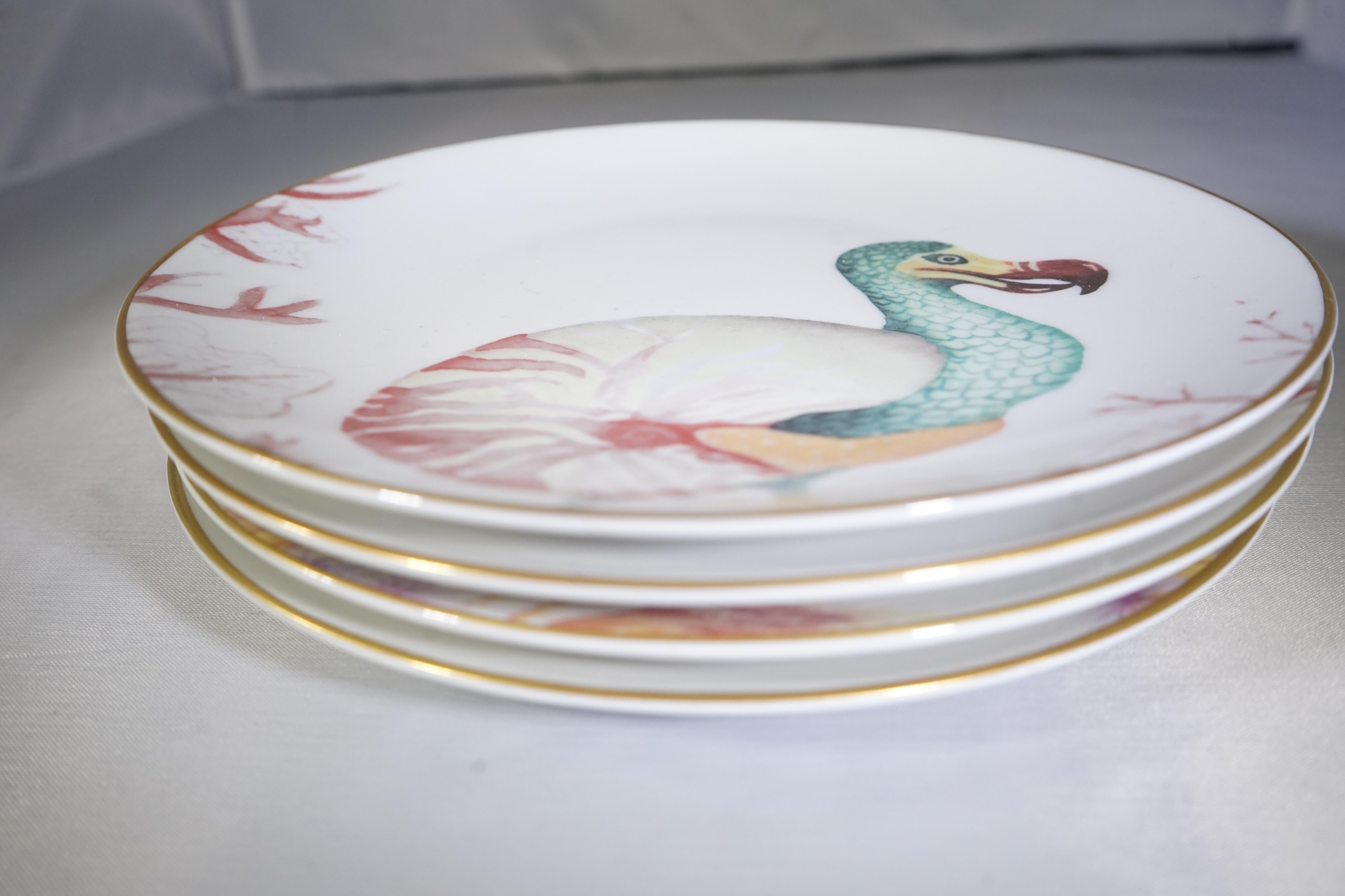 Contemporary Italian set of four whimsical underwater-themed plates crafted in Italy using Limoges porcelain by Dalwin Designs.