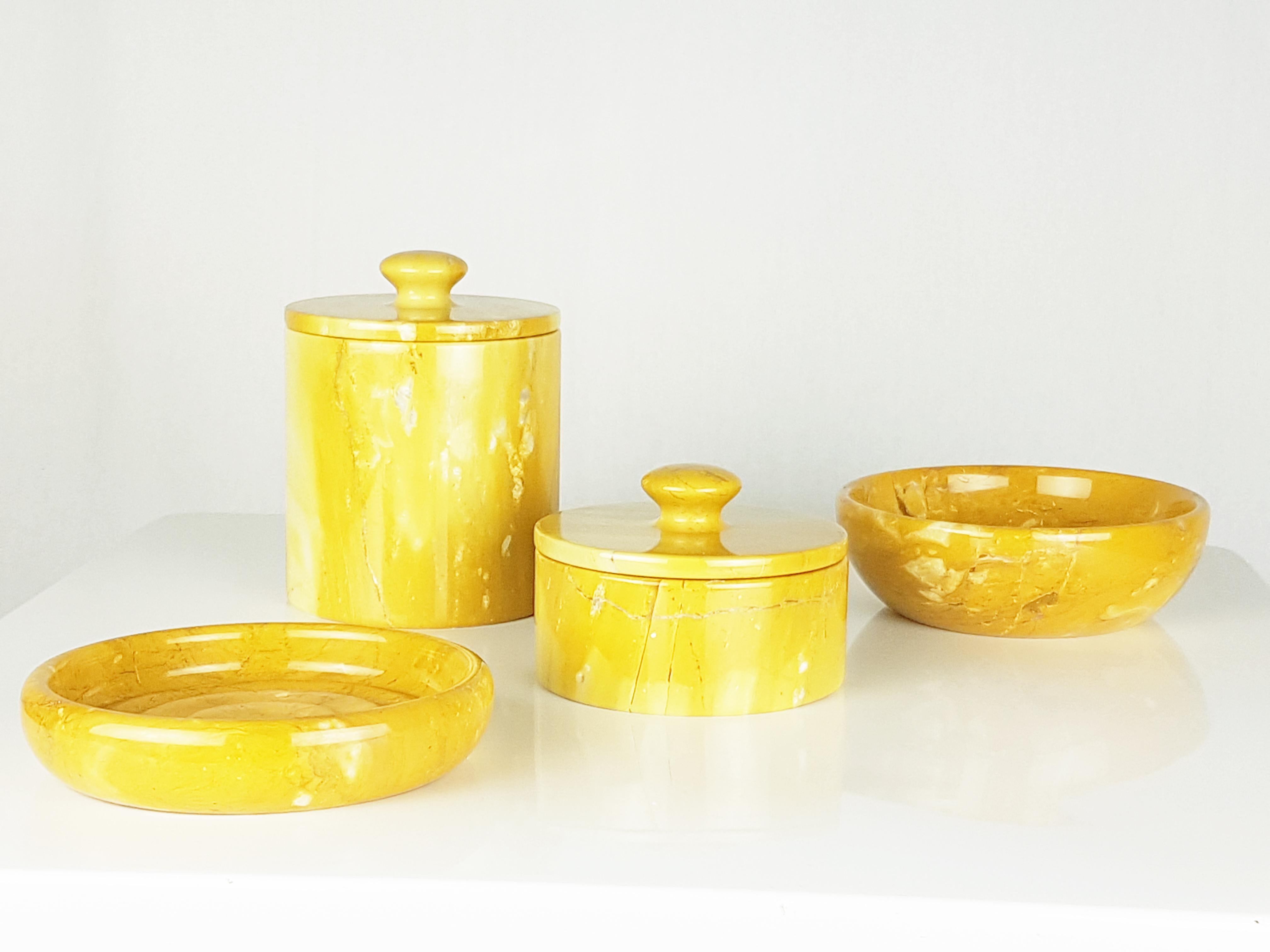 This set consists of 4 pieces made of yellow marble (I think it is the so-called 