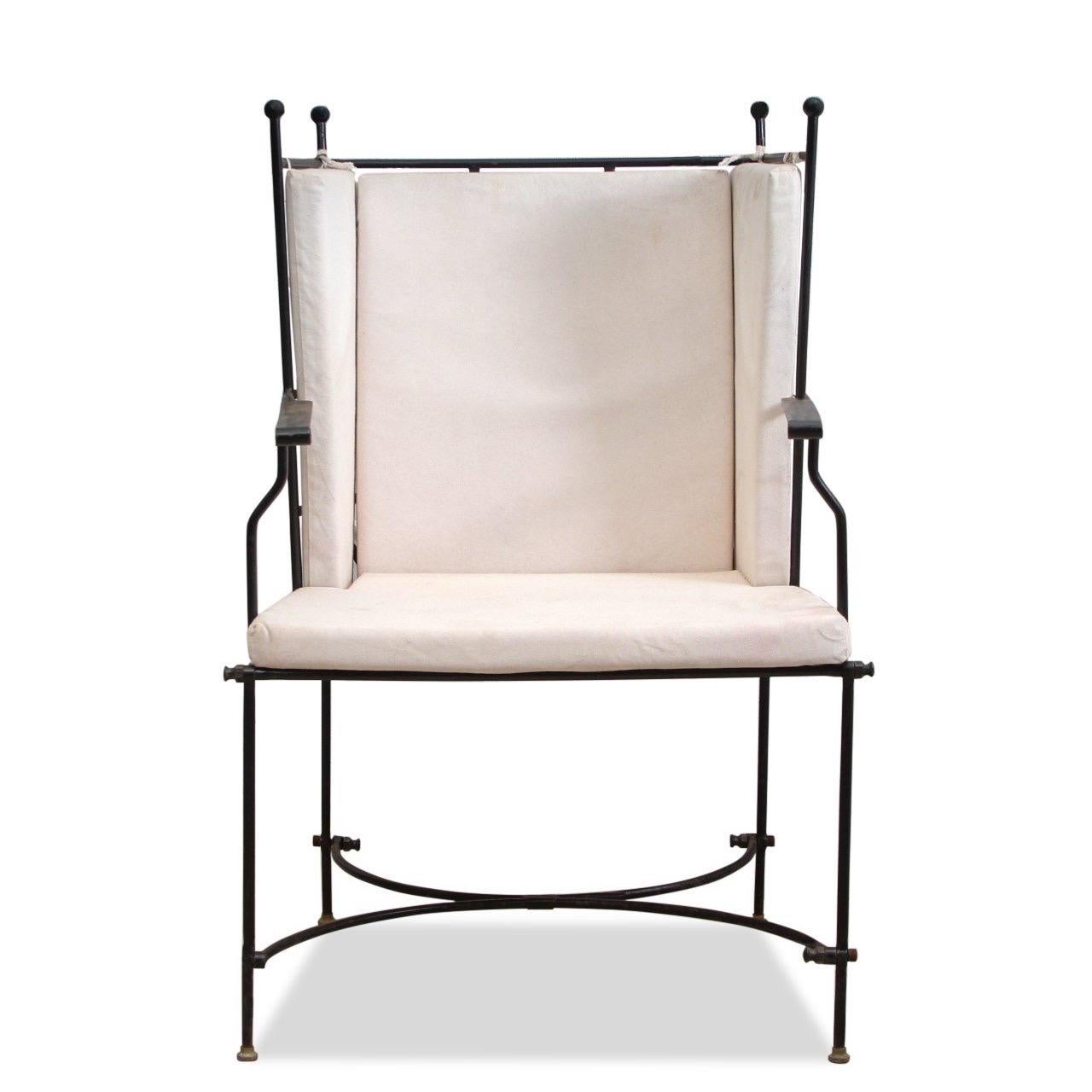 Set of four (4) indoor/outdoor armchairs in the style of Janus et Cie.

Details:
Black wrought iron metal frame.
Upholstery is made of high quality, high performance linen in white.

Dimensions:
22” W
23” D
38” H
18.5” Seat H
27.5” Arm H