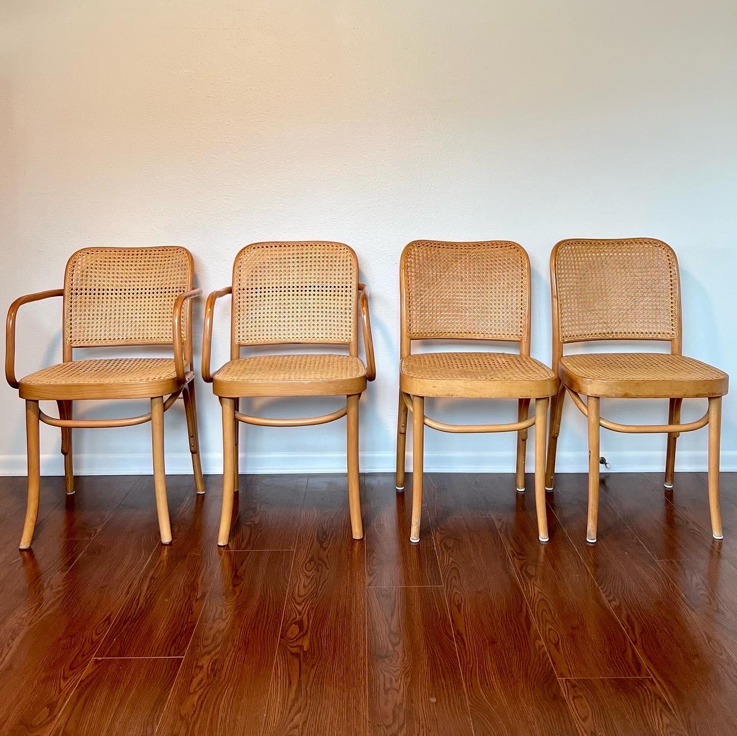 Gorgeous set of 4 Josef Hoffmann bentwood and cane chairs. Made in Poland with original FMG label. Includes 2 side chairs & 2 armchairs. Very good original condition with some flaws consistent with age. Please see photos. 

Dimensions:
32