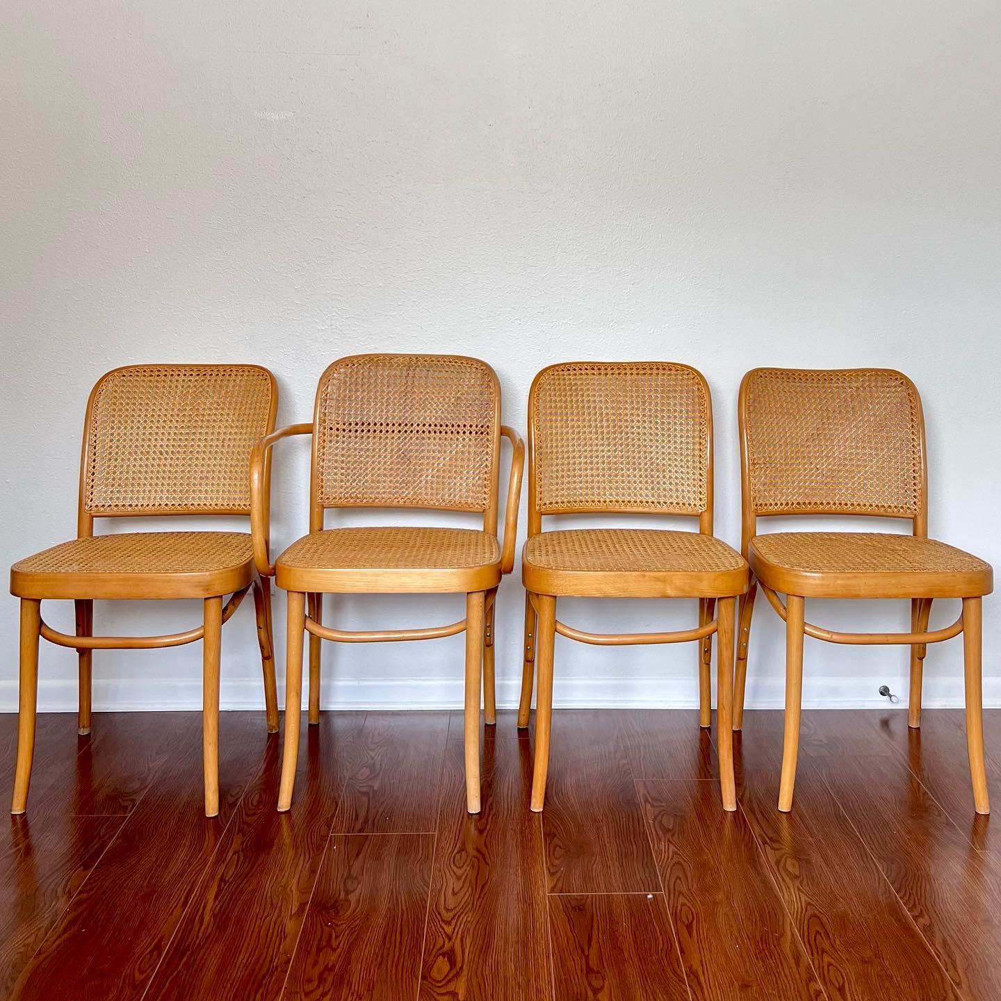 Gorgeous set of 4 Josef Hoffmann bentwood and cane chairs. Made in Poland with original FMG label. Includes 3 side chairs & 1 armchair. Very good original condition with some flaws consistent with age. Please see photos. 



Dimensions:
32