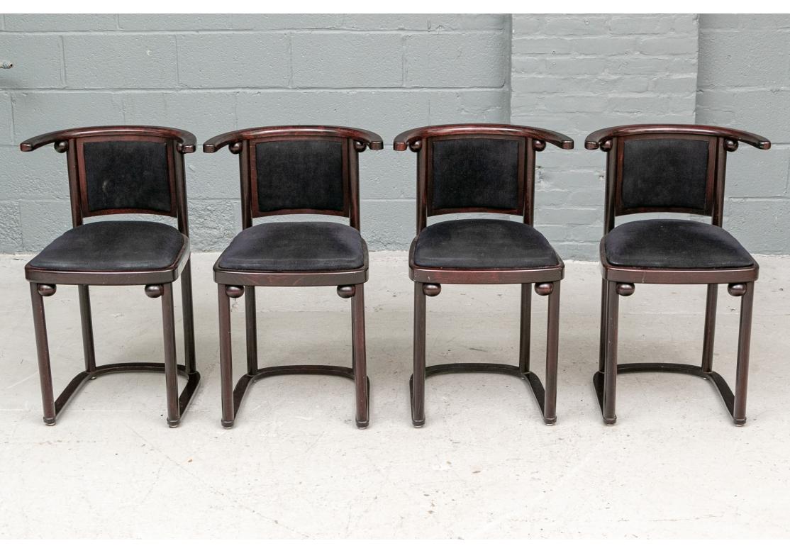 Classic Josef Hoffman 1907 Secessionist chair design for the Fledermaus Cafe in Vienna. Set of four Cafe chairs in black sueded upholstery coving the seat and backrest, the seat supported by four cylindrical legs with spherical elements, tub back