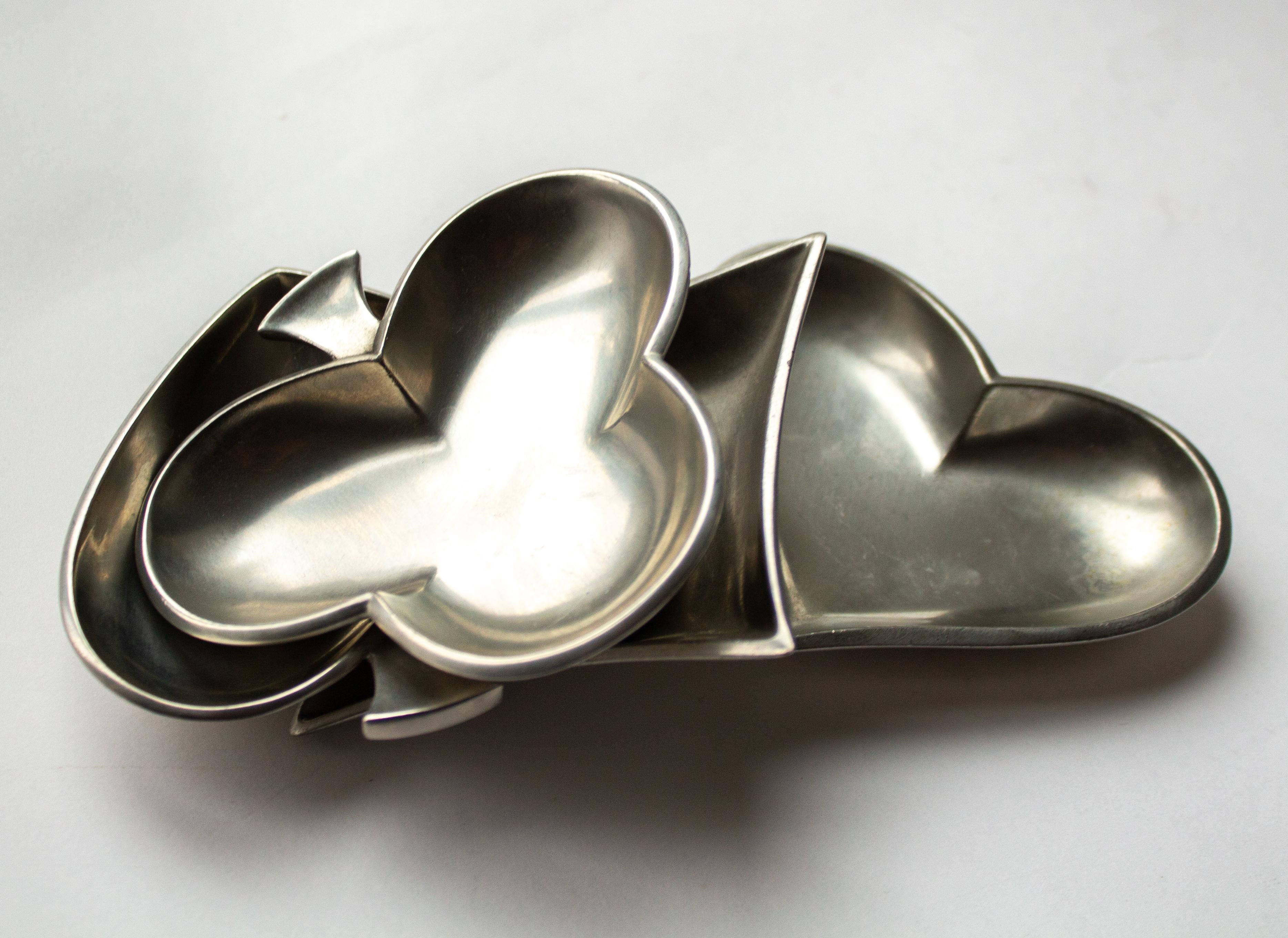 Set of 4 Mid-Century pewter dishes in shape of playing card by Just Andersen, Denmark. Stamped Just, Denmark, 2630, 2631, 2632, 2633 

Just Andersen was born July 13, 1884 in Godhavn, Greenland. He studied at the Royal Academy of Art in Copenhagen