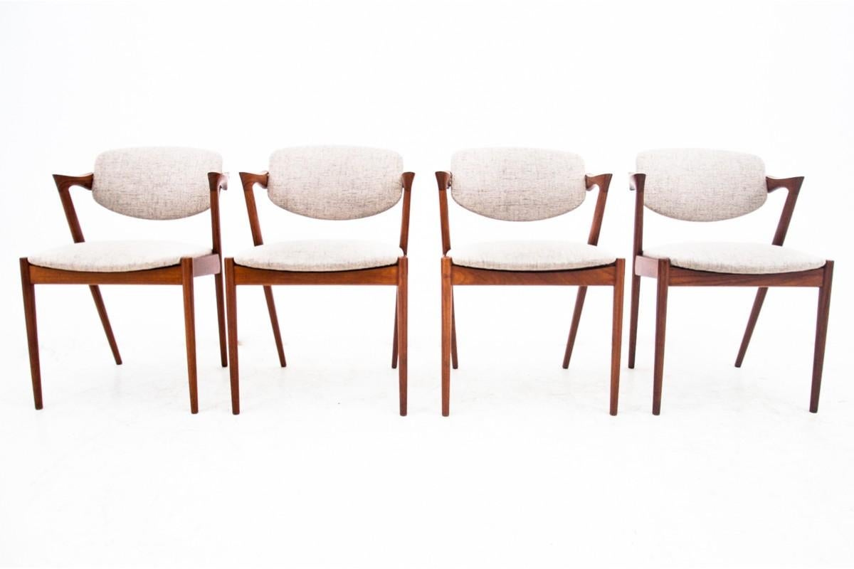 A set of 4 iconic teak chairs model 42 designed by Kai Kristiansen. Made in Denmark in the 1960s.

Excellent condition after renovation and replacement of upholstery. An icon of Scandinavian design from the mid-20th century.

dimensions: height 75